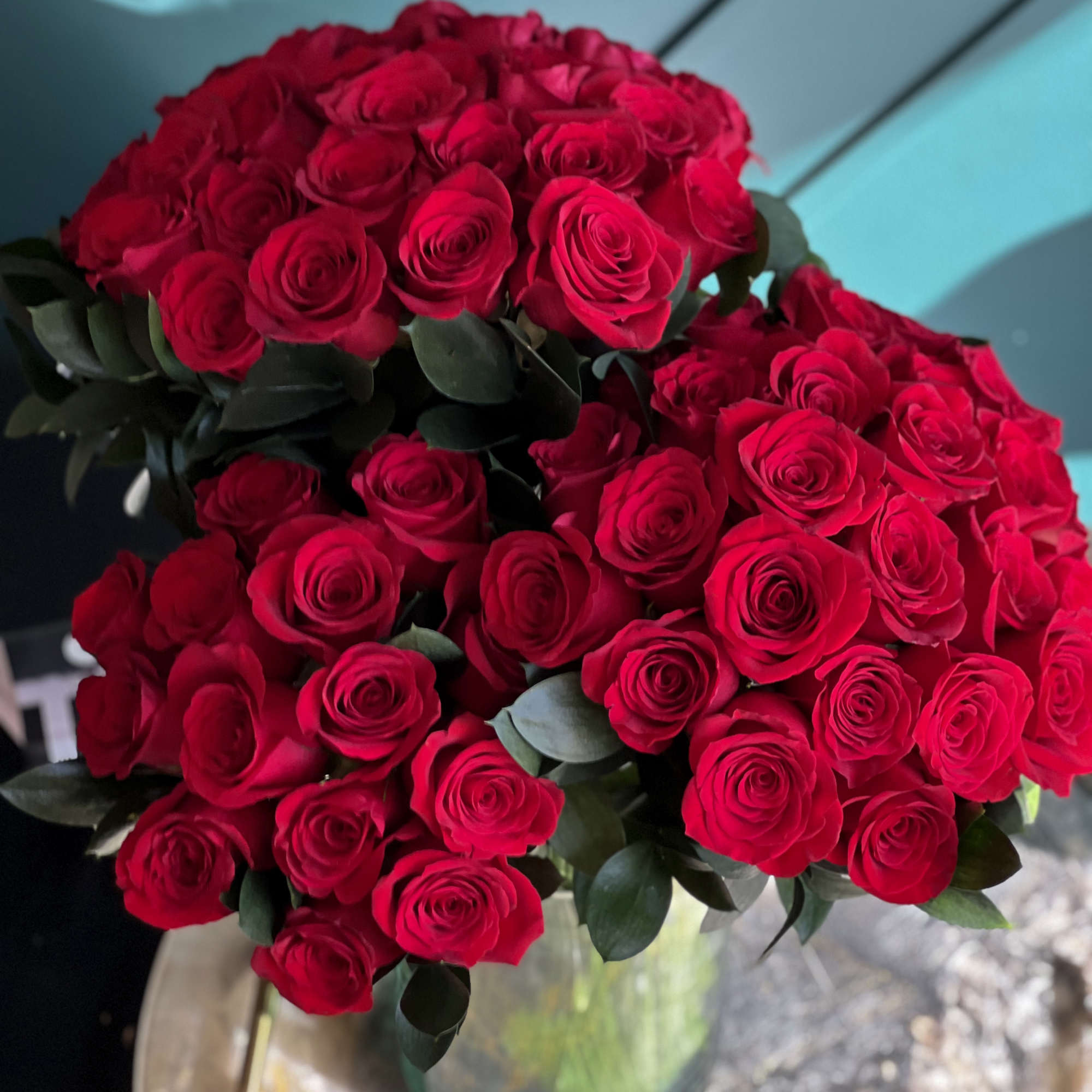 6 dozen fresh cut red roses in clear vase