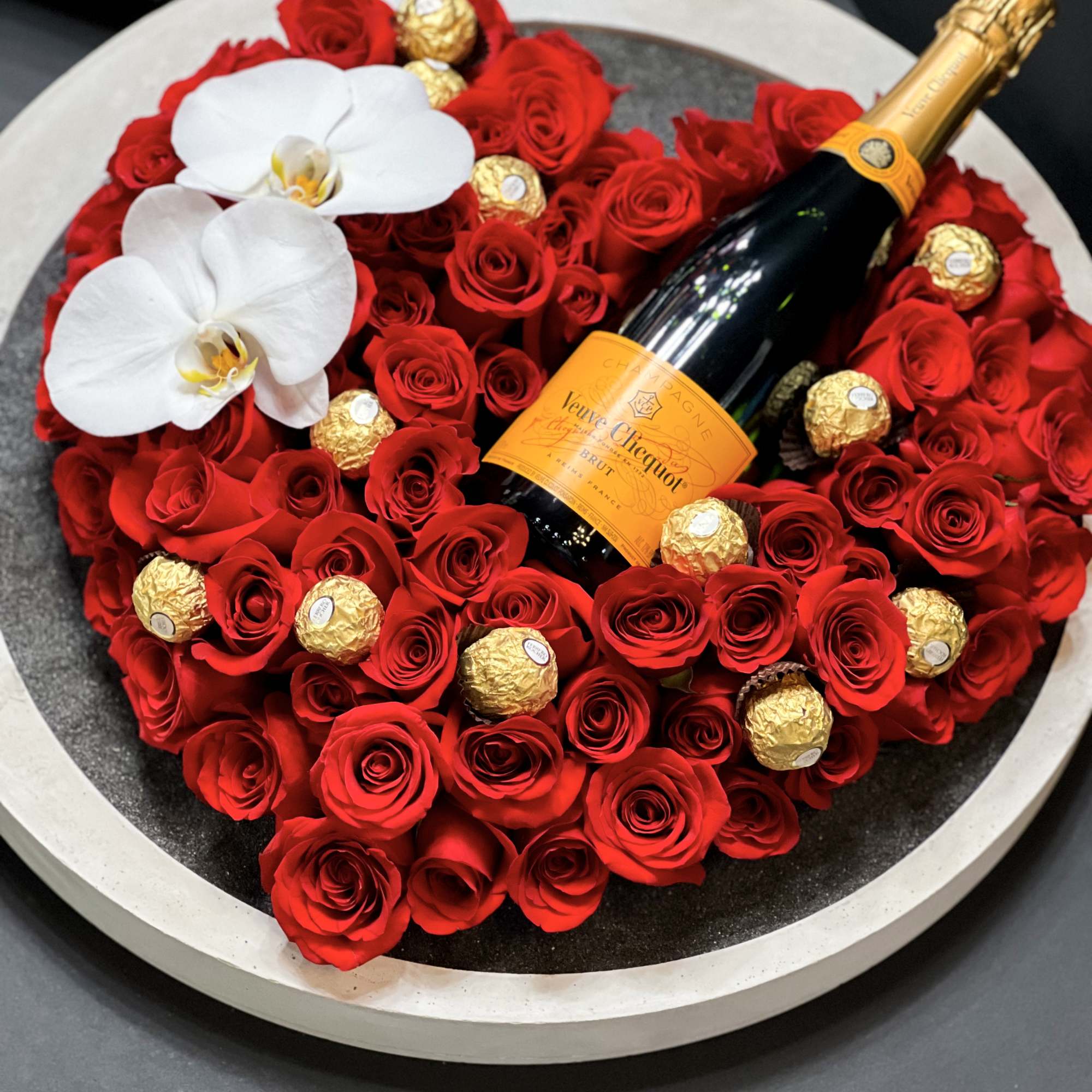 Product Details:
EXTRA LARGE Unique modern arrangement with 100 and above red roses