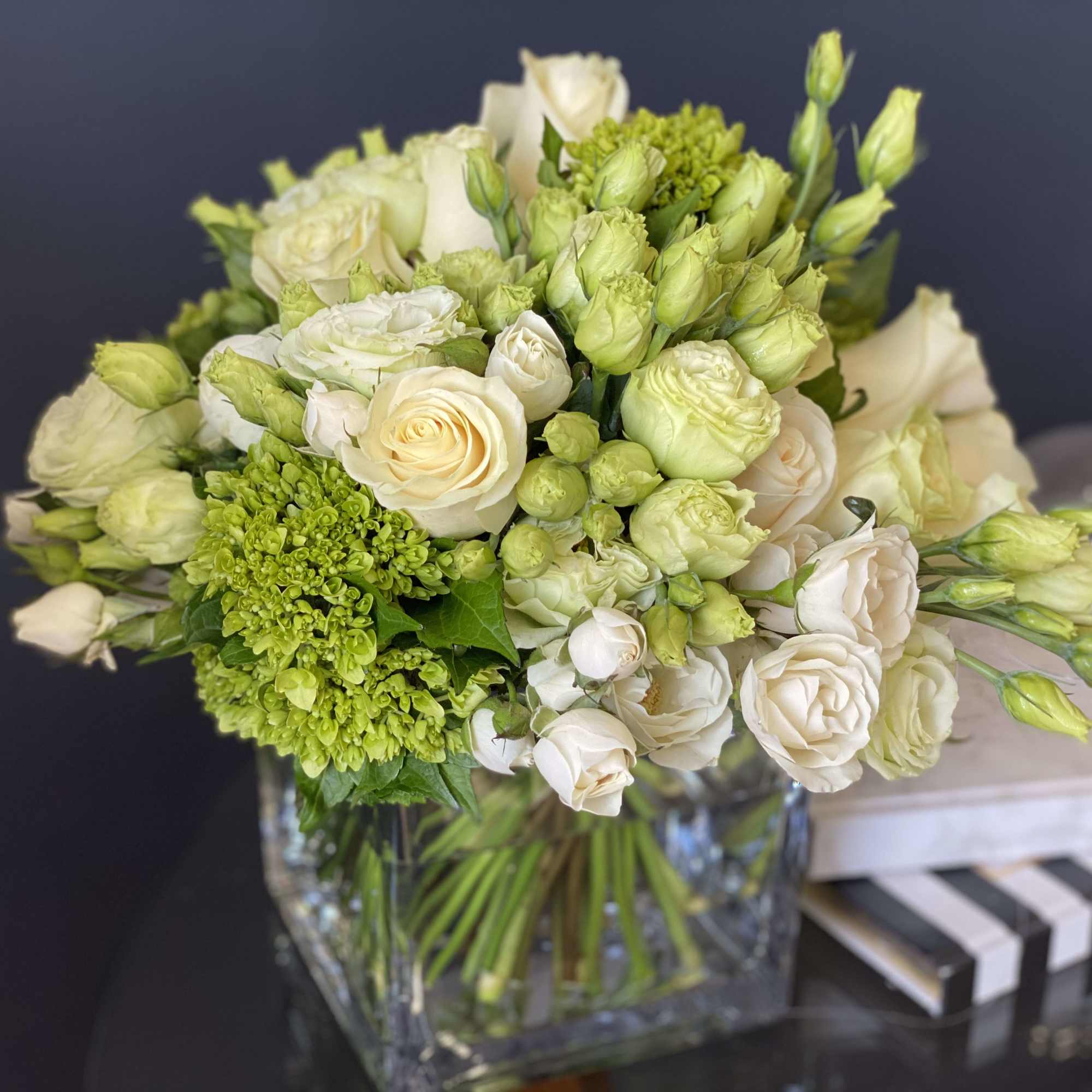 Perfect mix of white roses, spray roses, green hydrangeas and lisianthus 
