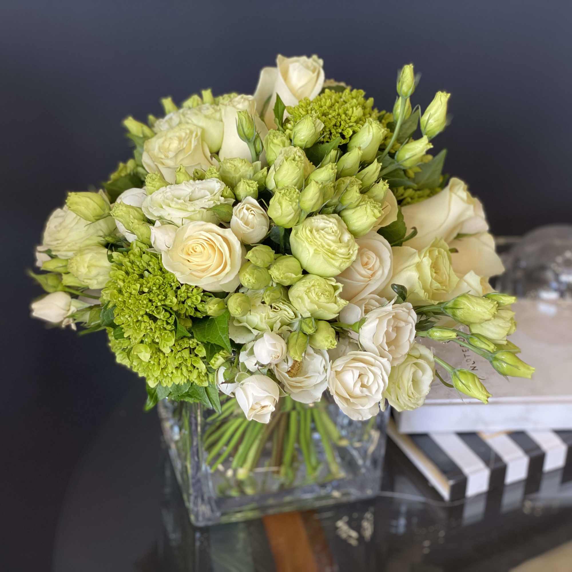 Perfect mix of white roses, spray roses, green hydrangeas and lisianthus 