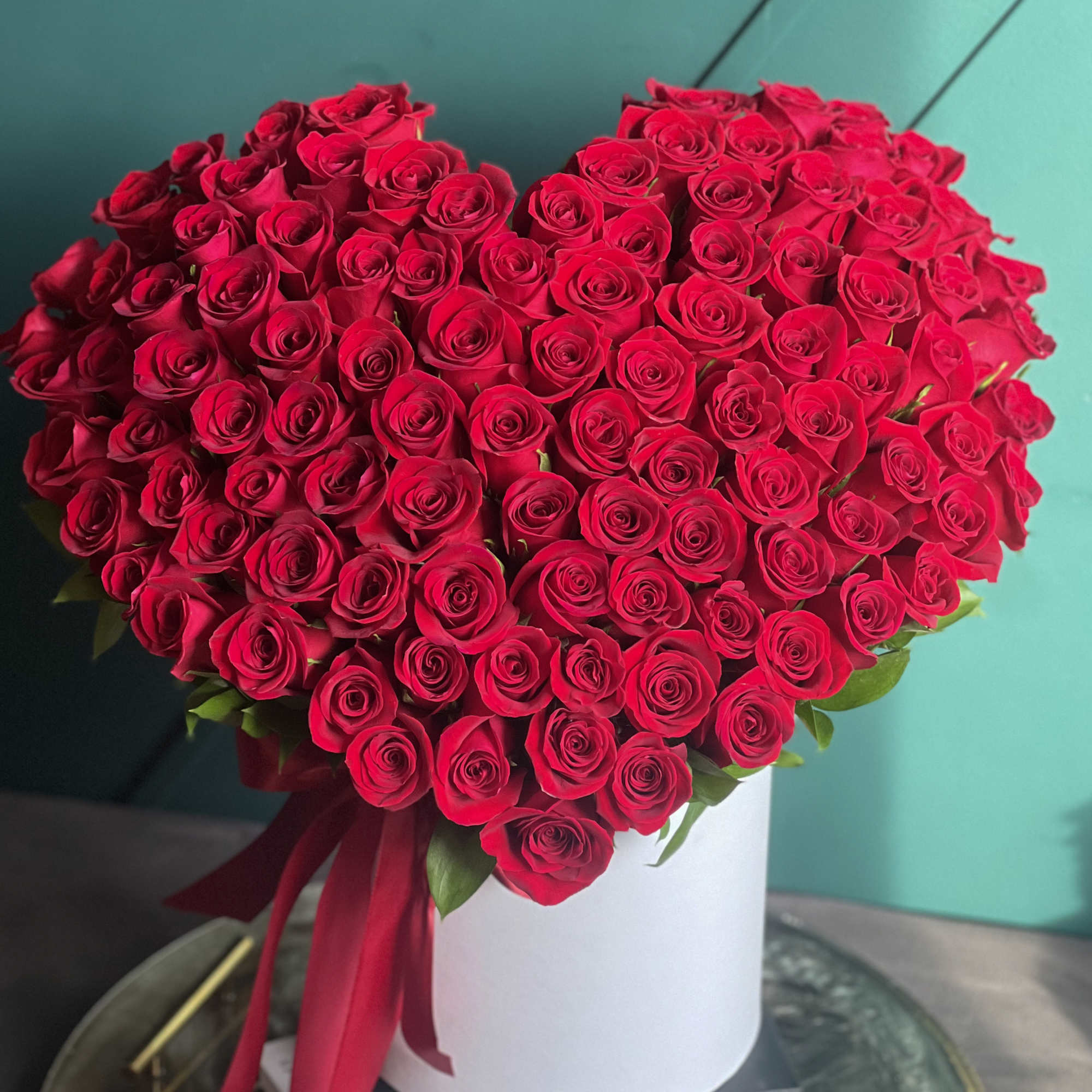 100 red roses. Heart-shaped roses design 