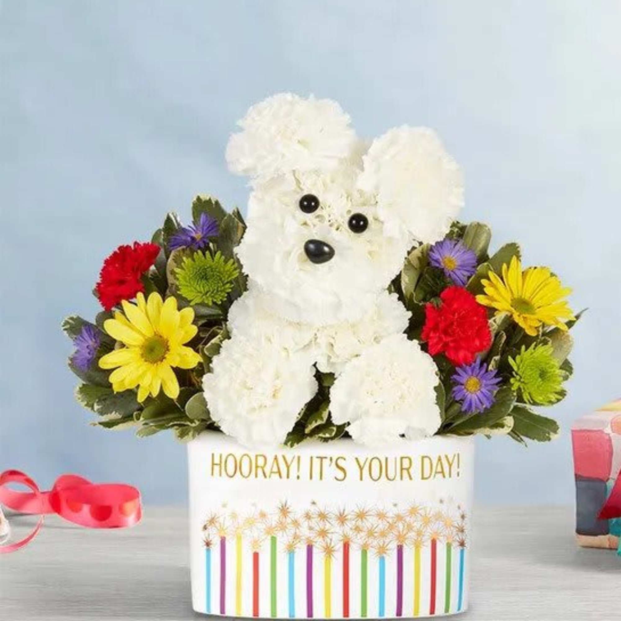 EXCLUSIVE A welcome guest at any gathering! Our adorable flower pup is