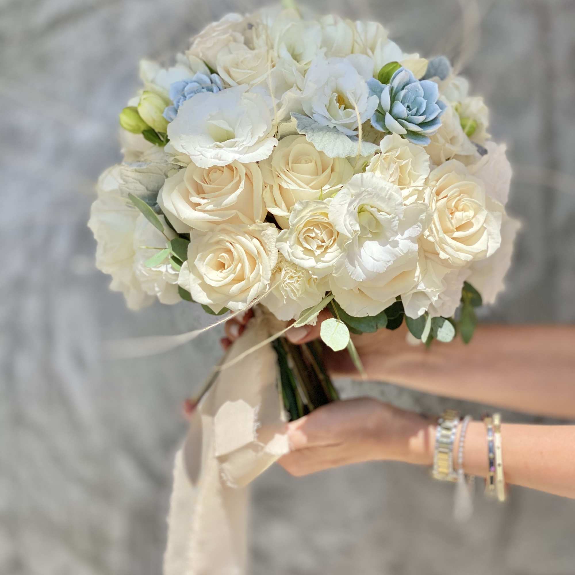 A stunning wedding bouquet for the bride or bridesmaids. Arrangement in ivory