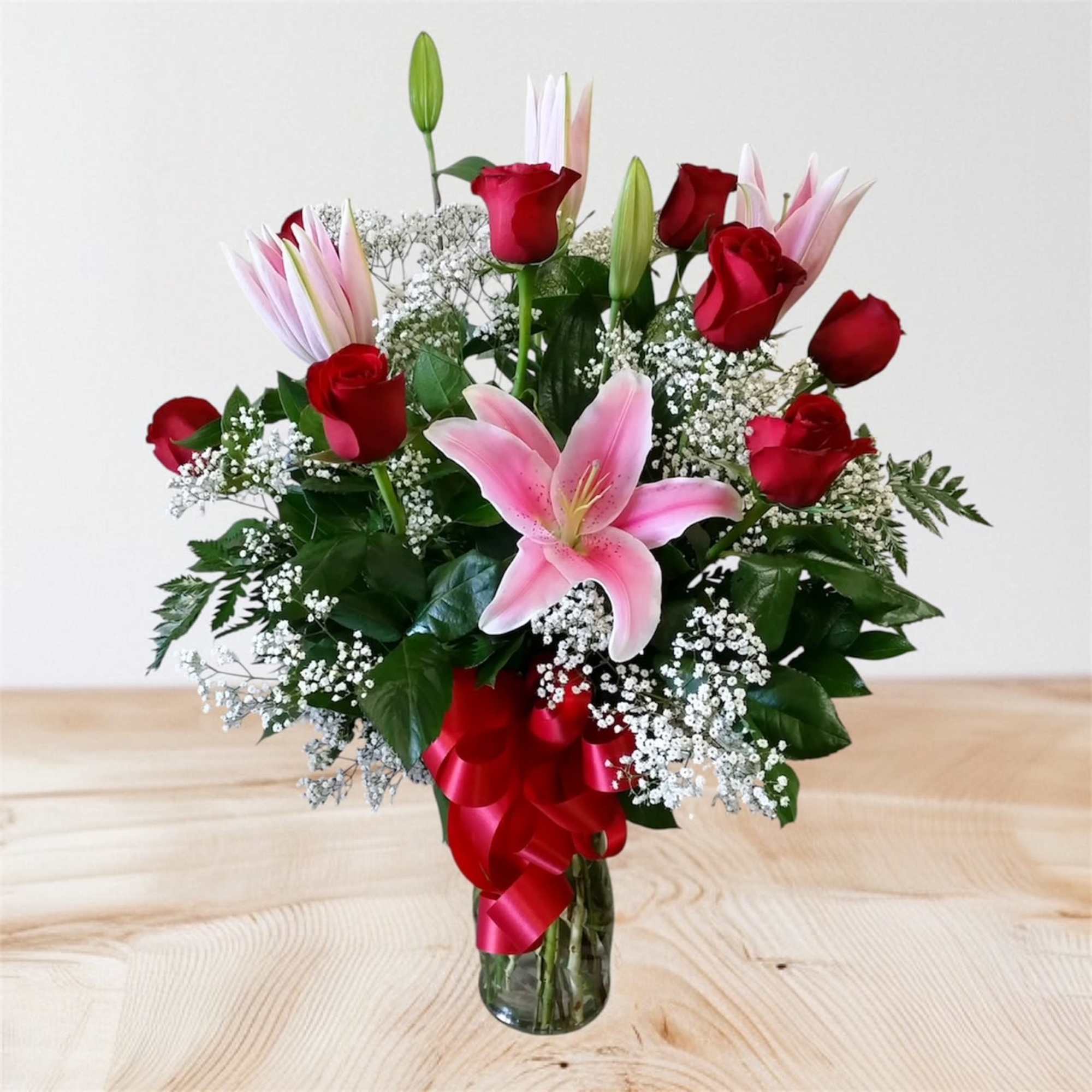 Indulge in the timeless elegance of our Luxurious Love floral arrangement, a