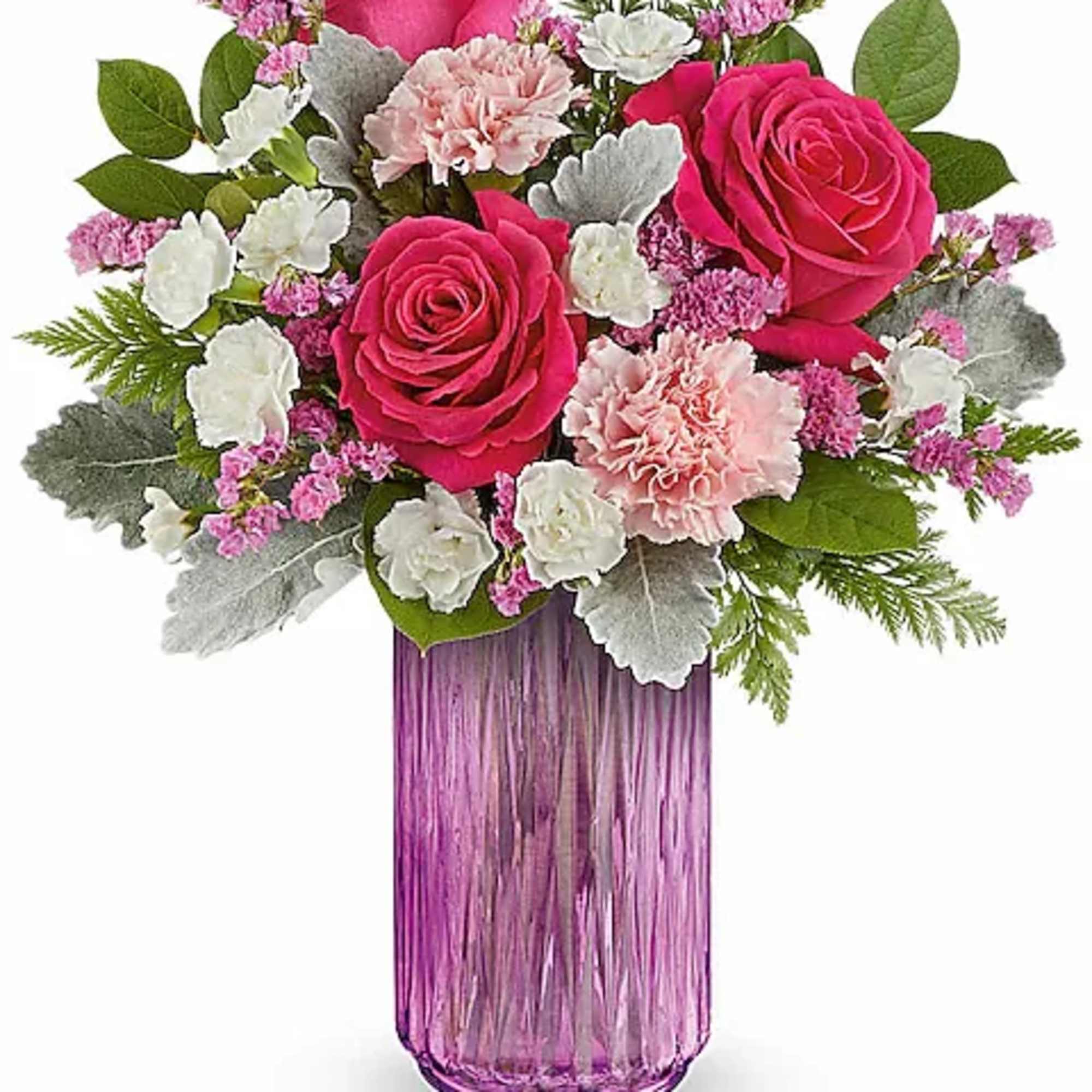 Celebrate the beauty of spring with this enchanting floral arrangement, featuring a