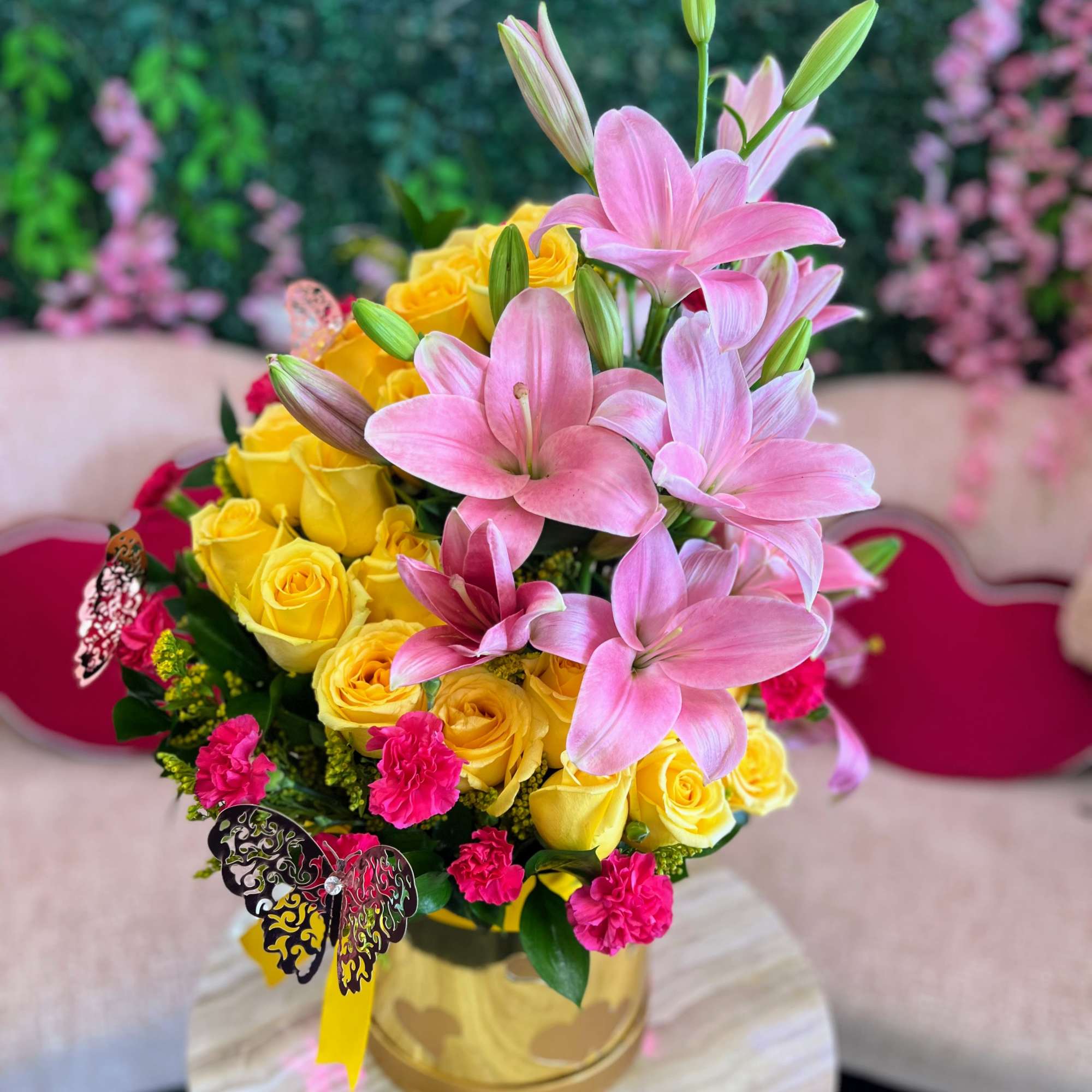 A breathtaking fusion of sunny yellow roses and delicate pink lilies, the A breathtaking fusion of sunny yellow roses and delicate pink lilies, the