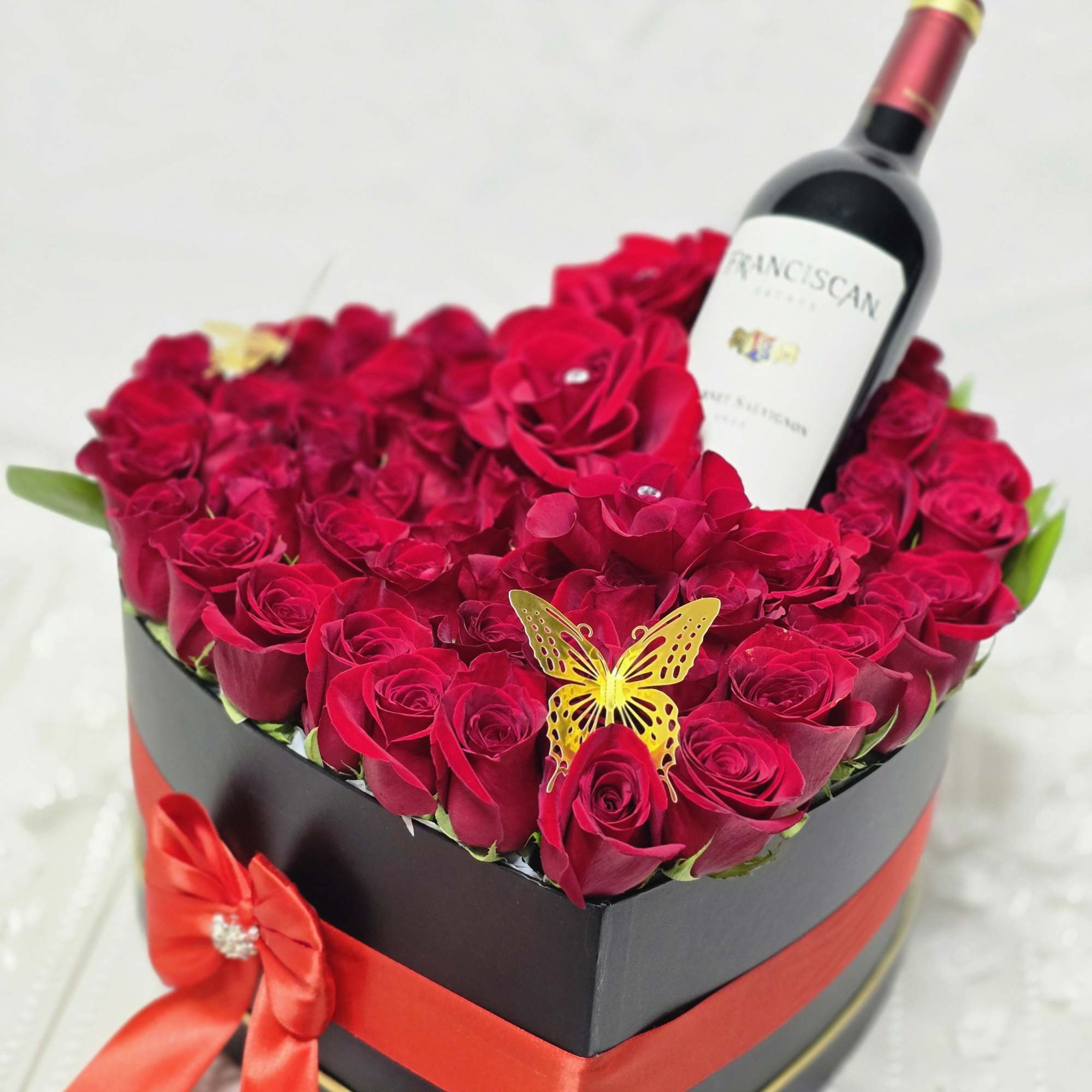 Bold Romance, Perfectly Poured 
This striking arrangement features passionate red roses inside