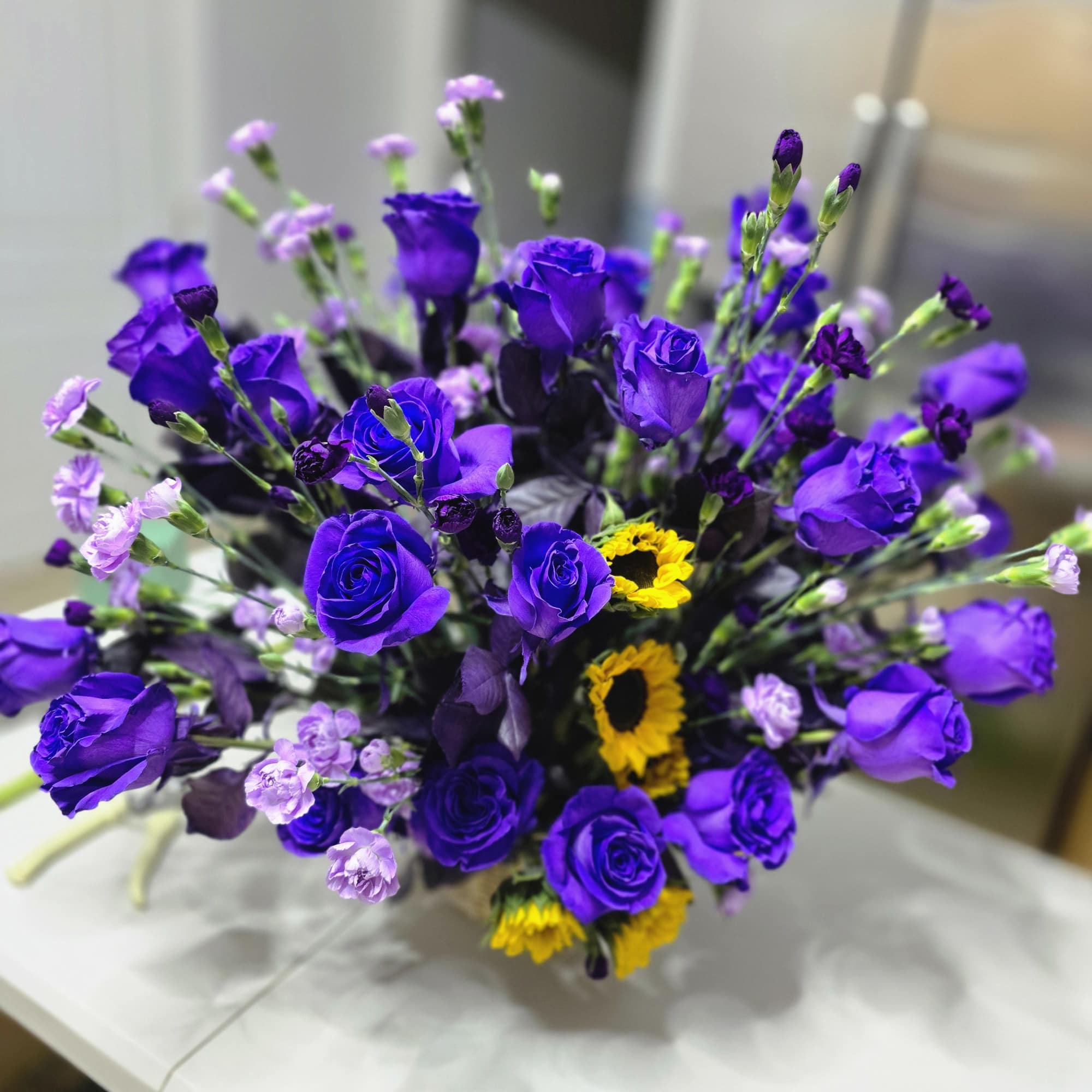 Where Elegance Meets Sunshine 
This eye-catching centerpiece combines the bold joy of