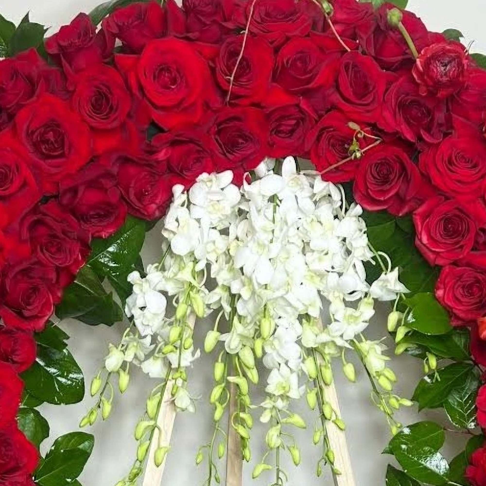 This dramatic and luxurious wreath combines the timeless beauty of red roses This dramatic and luxurious wreath combines the timeless beauty of red roses