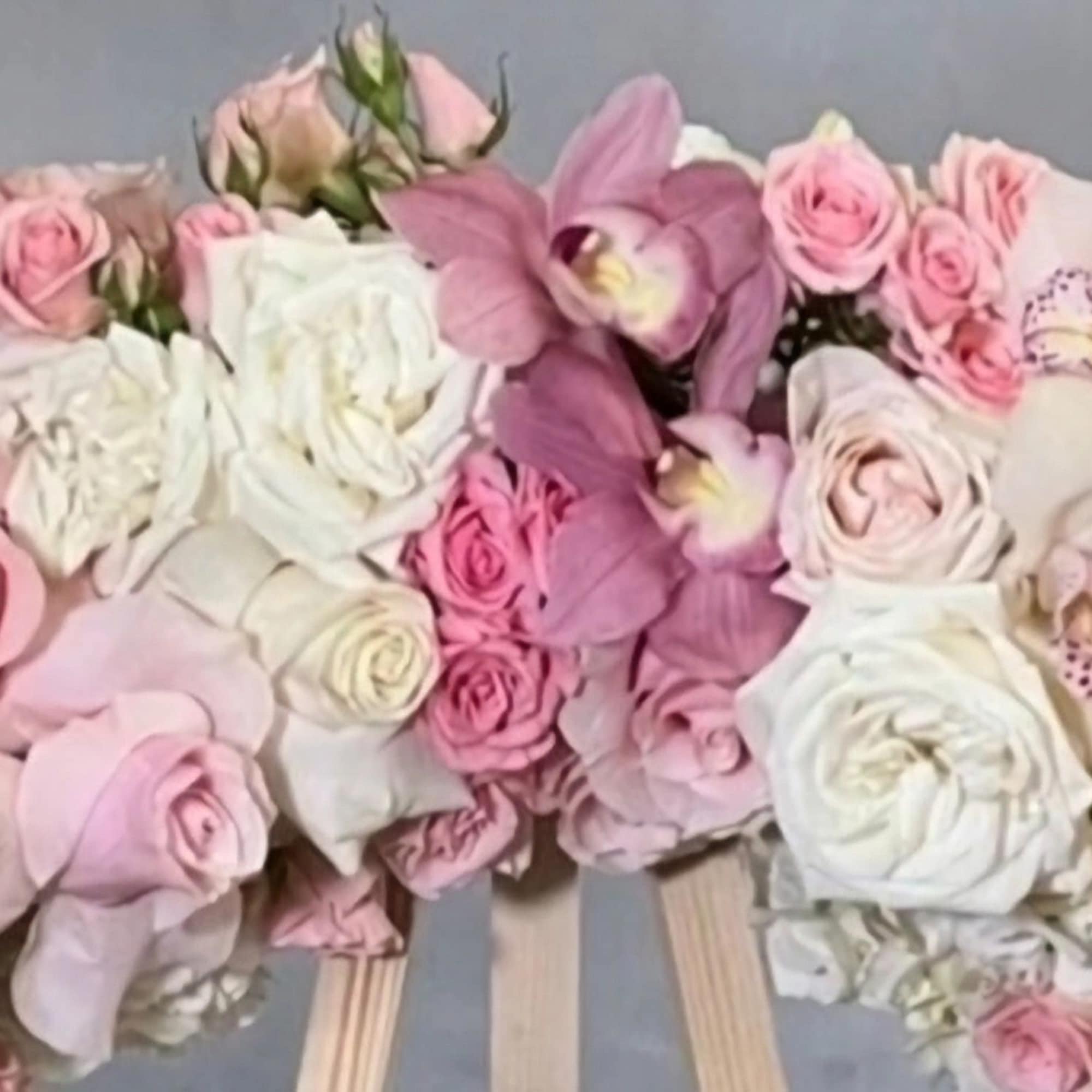 This elegant wreath arrangement is crafted from a beautiful array of soft This elegant wreath arrangement is crafted from a beautiful array of soft