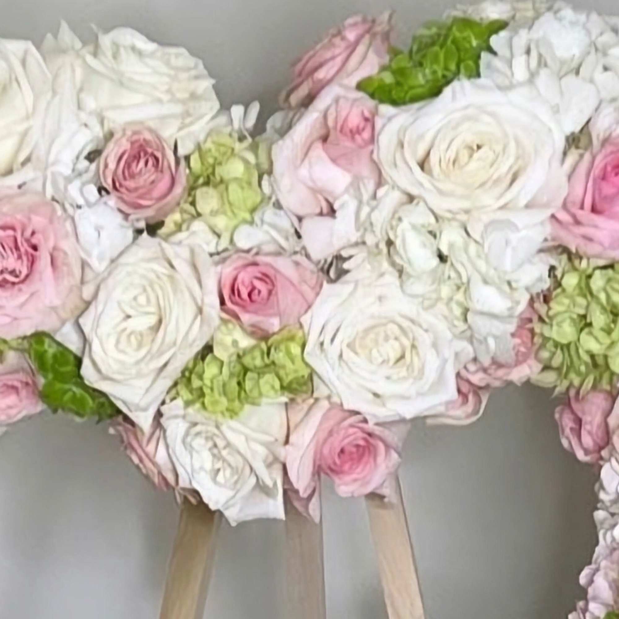 This heart-shaped arrangement is a touching tribute made with a harmonious blend This heart-shaped arrangement is a touching tribute made with a harmonious blend