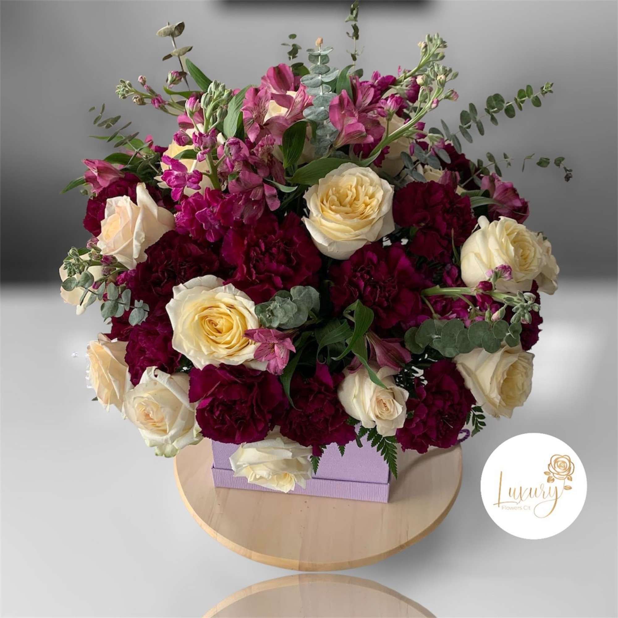 Our exclusive designs of fresh flowers in the beautiful box are a