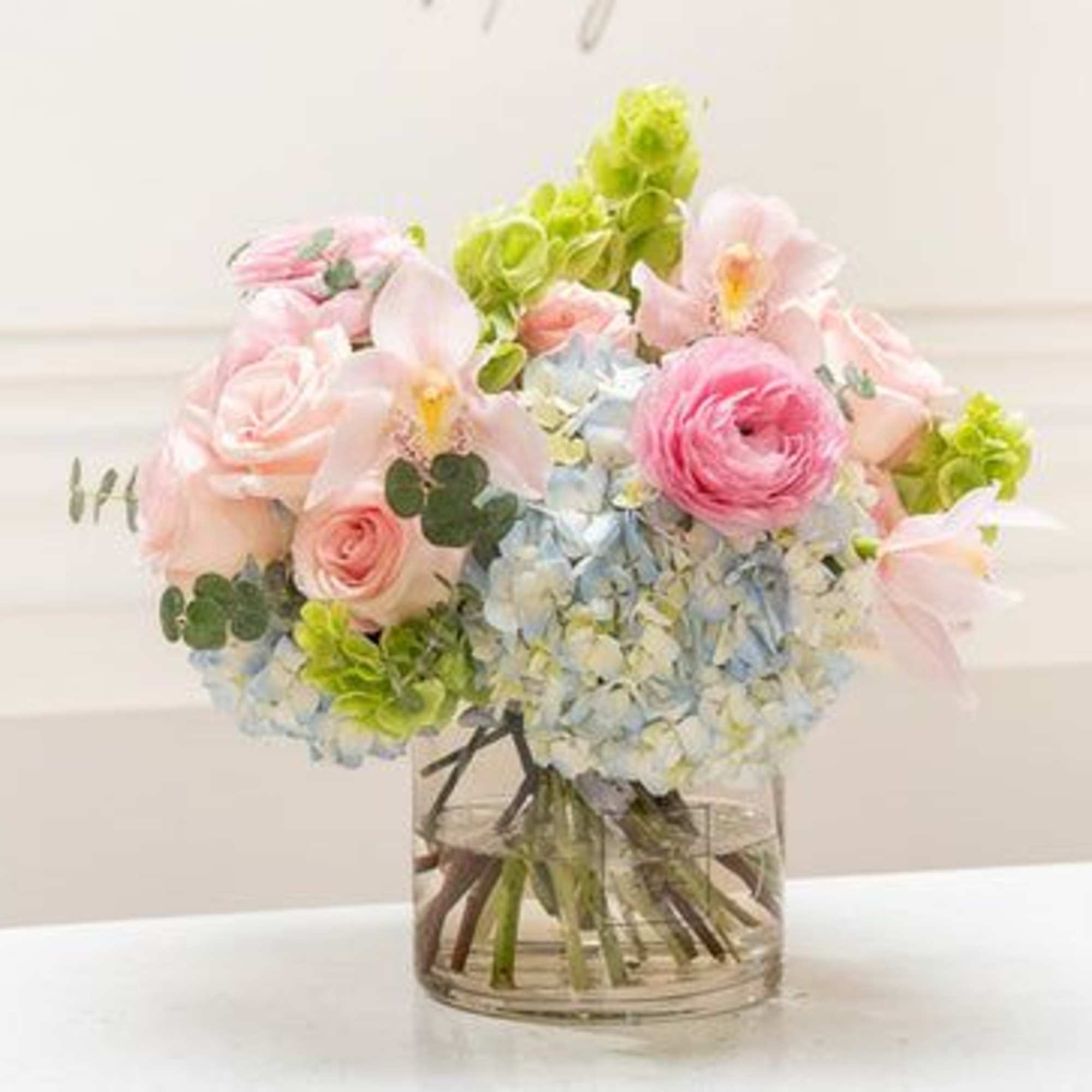 This mixed flower bouquet in a vase is a heartfelt expression of