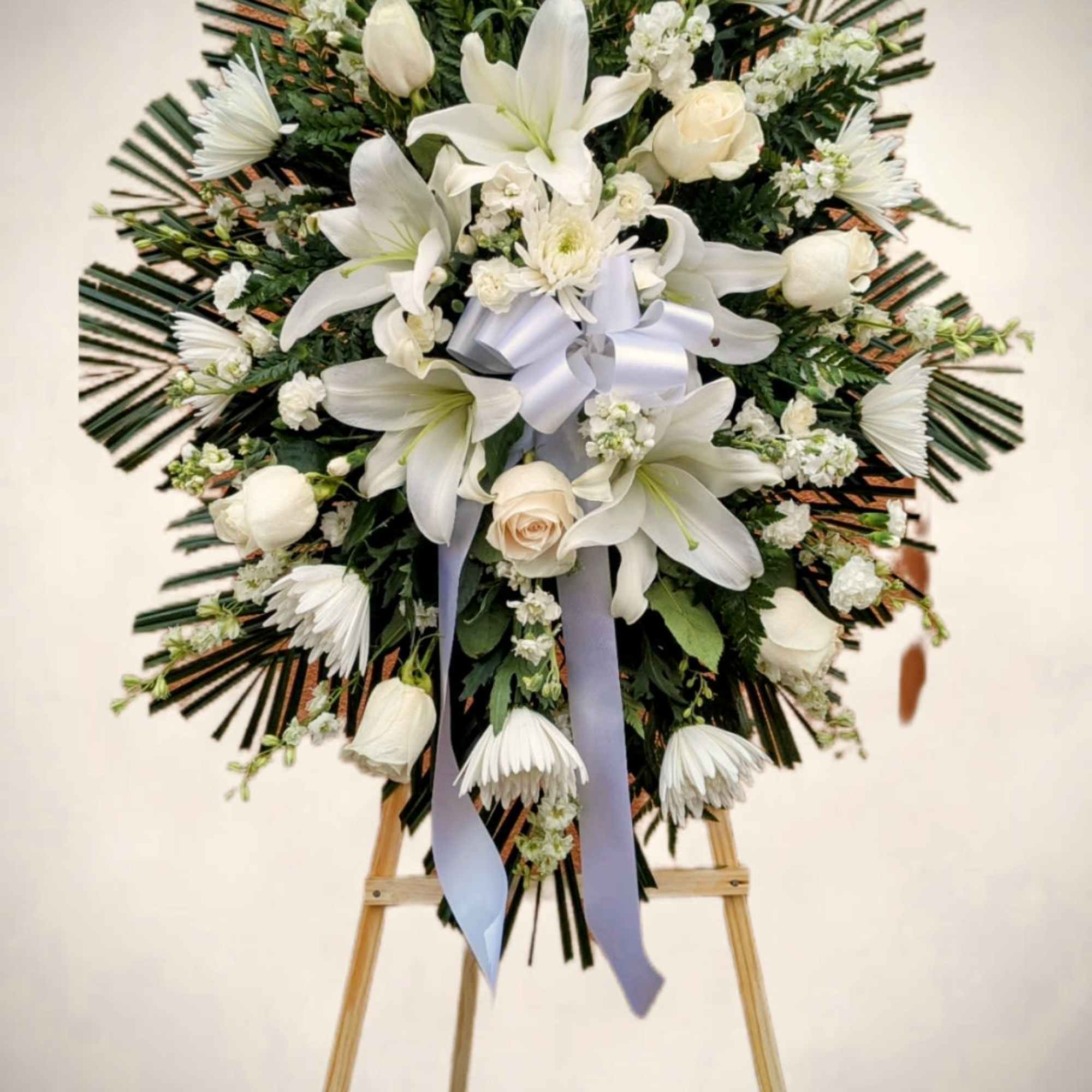 Honor a life beautifully lived with this elegant standing spray, thoughtfully arranged
