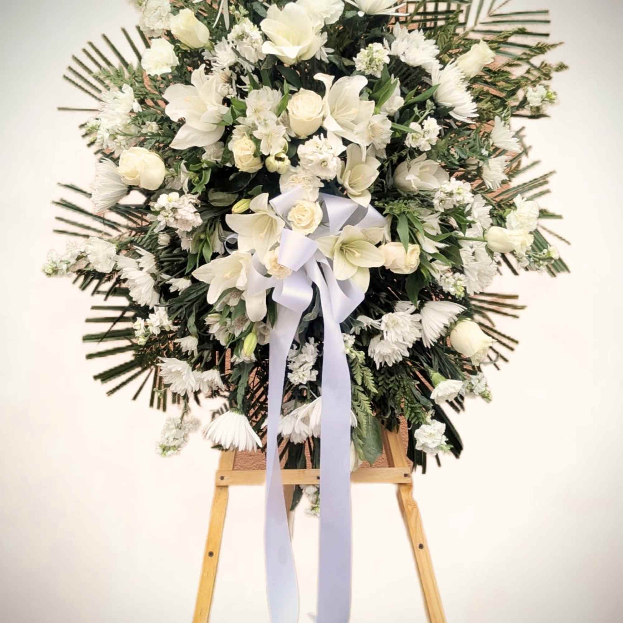 Honor a life beautifully lived with this elegant standing spray, thoughtfully arranged