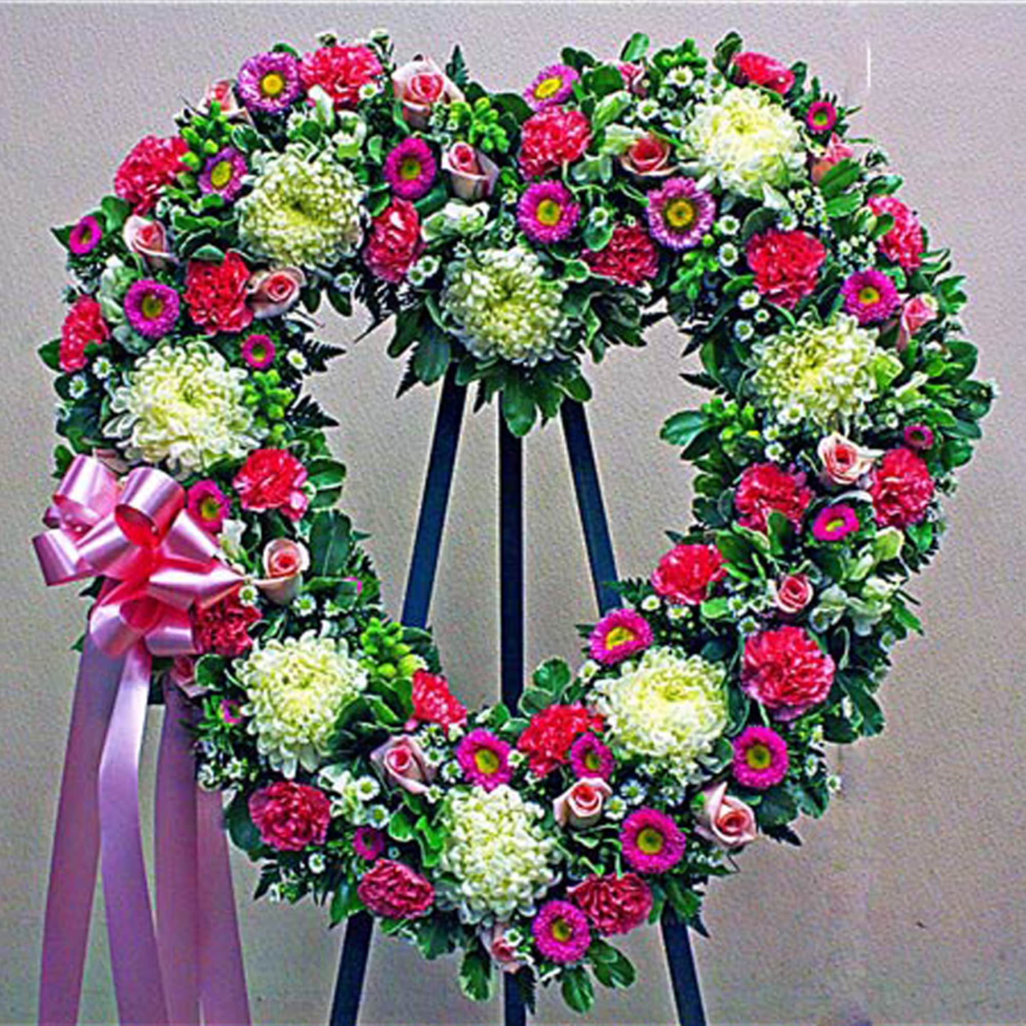 Send a heartfelt message with this beautiful standing spray, created with cheery