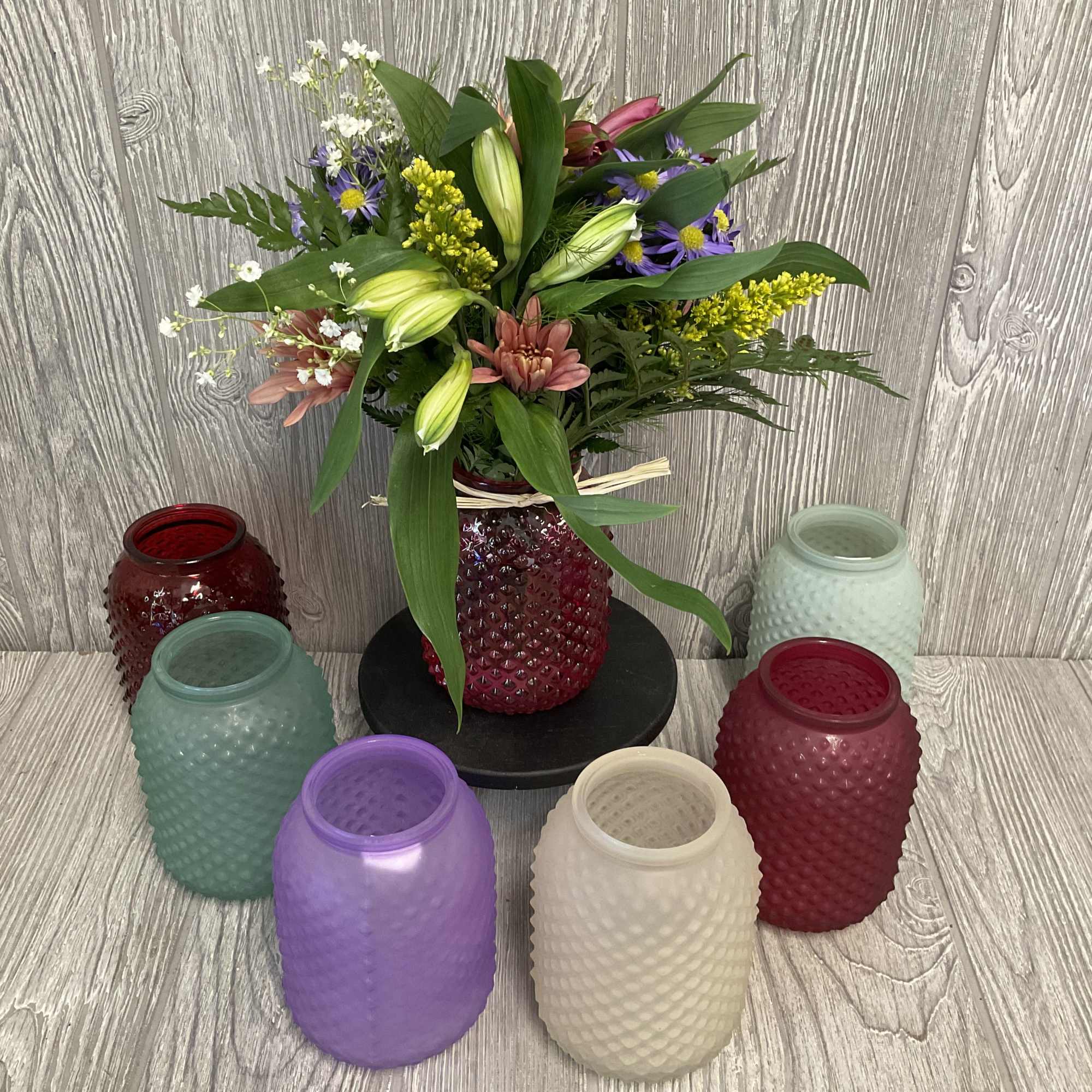 Wildflower arrangement designed to look like the flowers were fresh picked along Wildflower arrangement designed to look like the flowers were fresh picked along