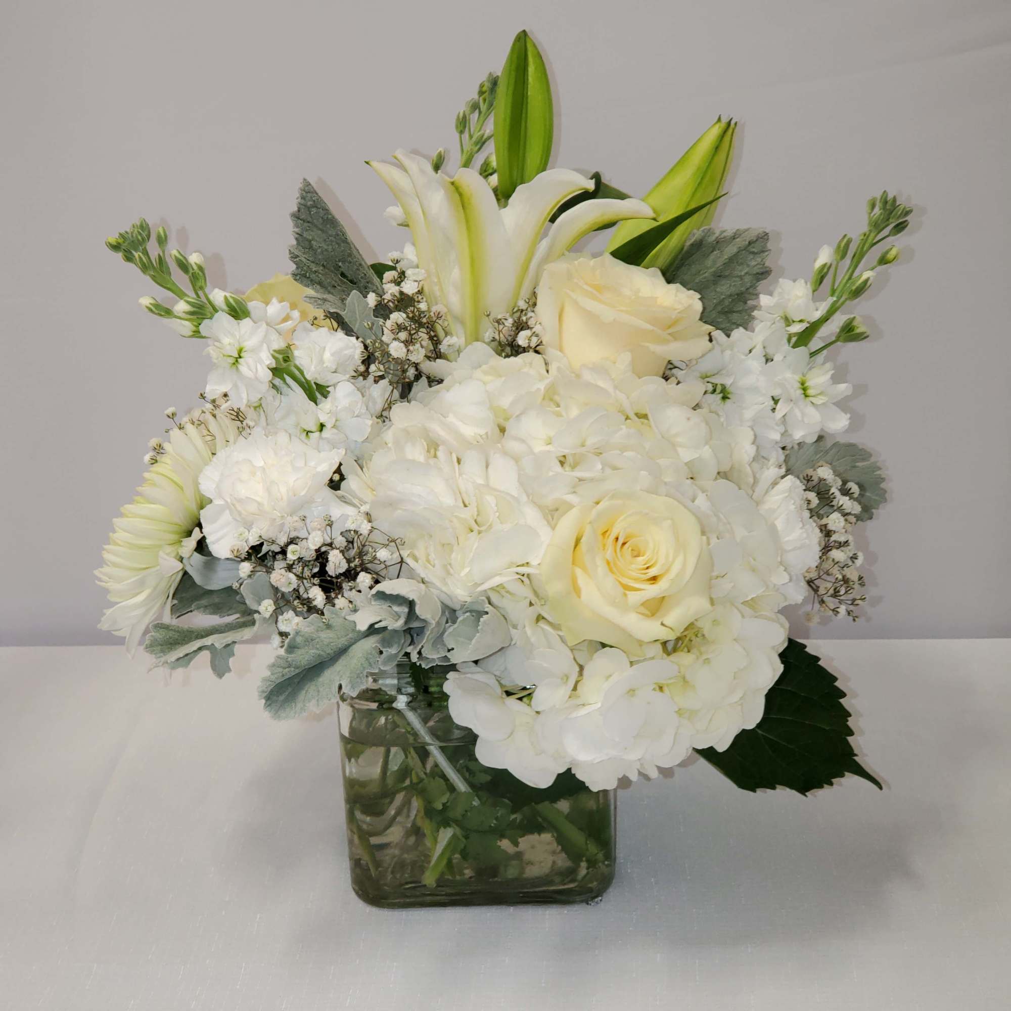all white low arrangements in a square vase all white low arrangements in a square vase