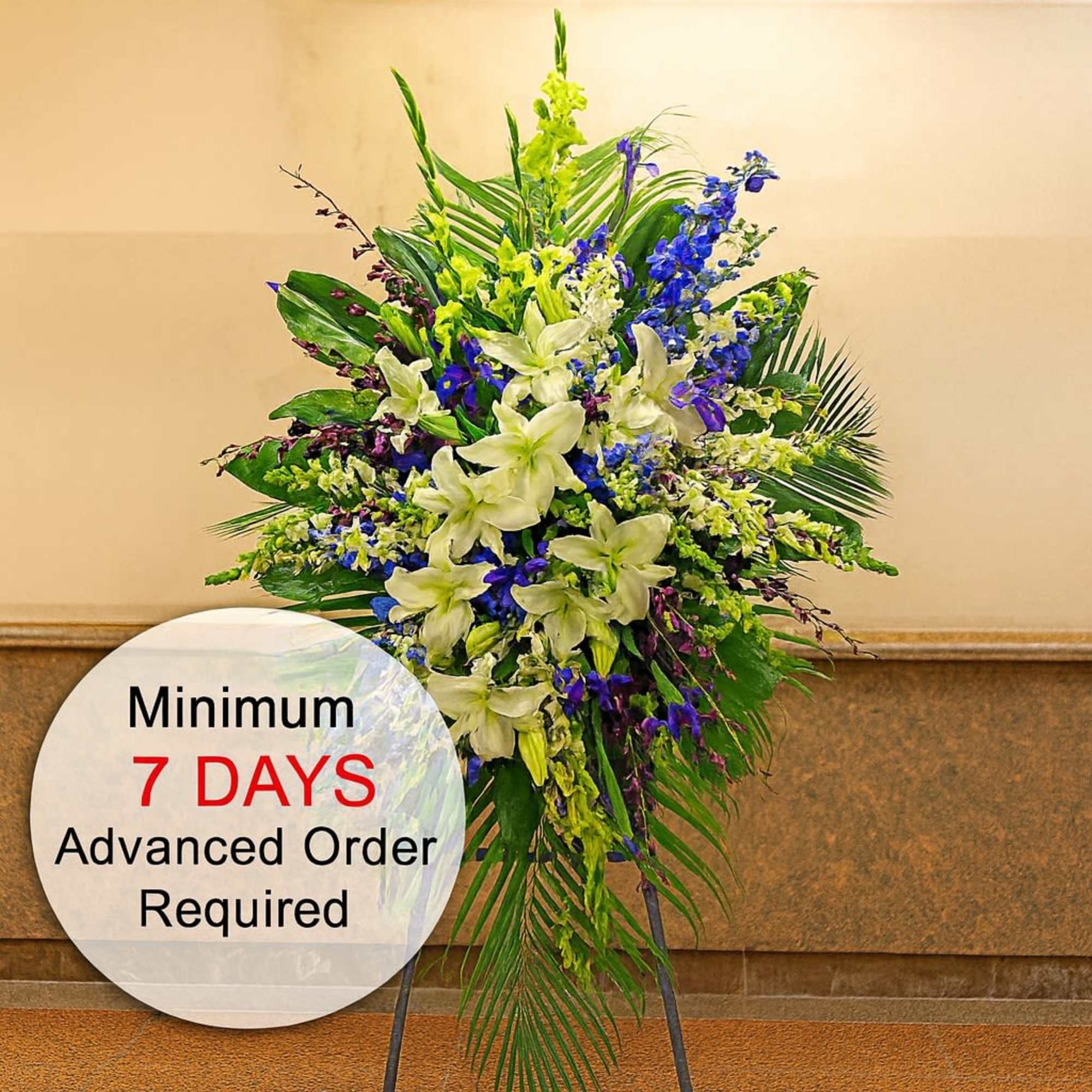This elegant standing spray, full of gladioluses, and lilies, is a beautiful