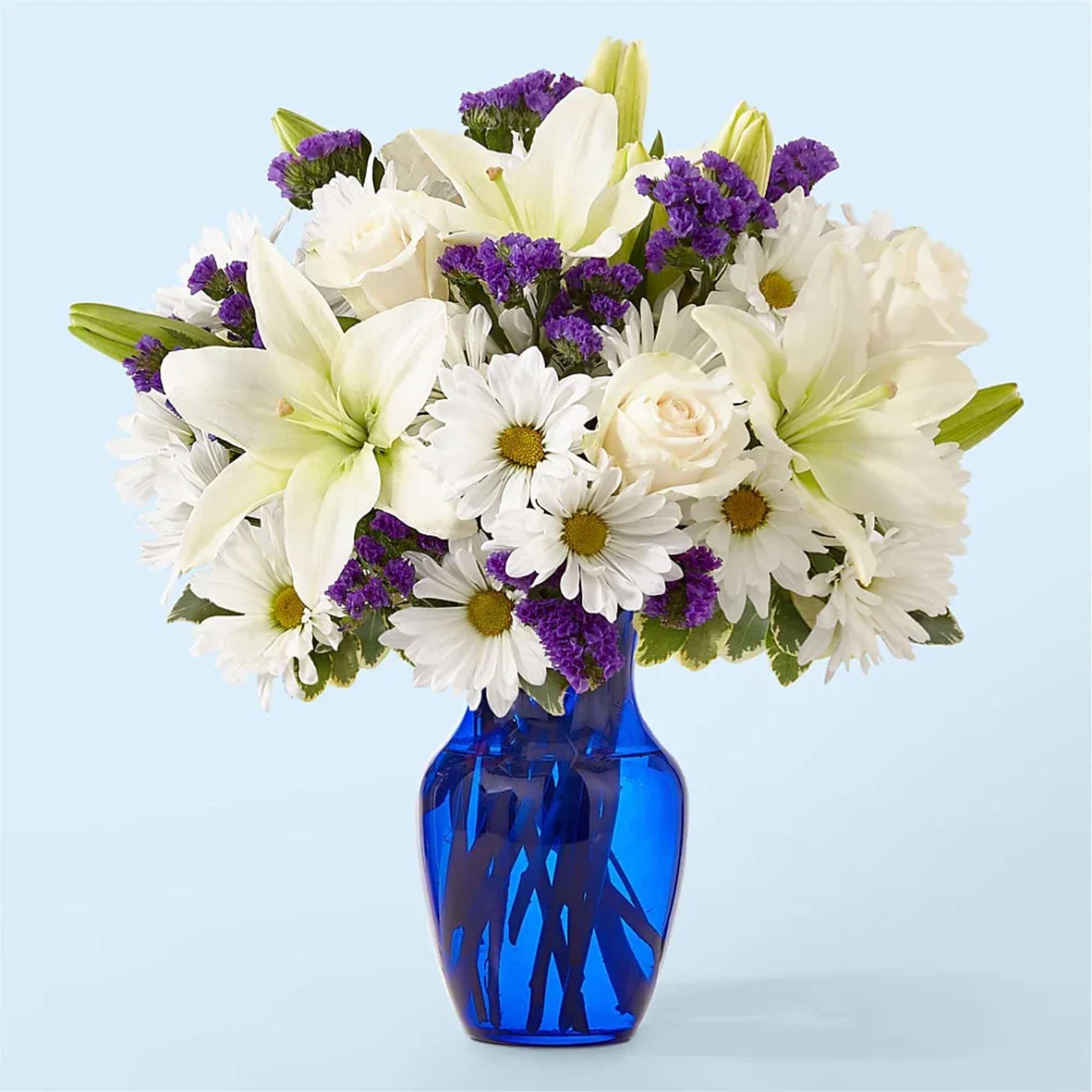 Deep purple blooms accented by creamy whites create a striking gift for