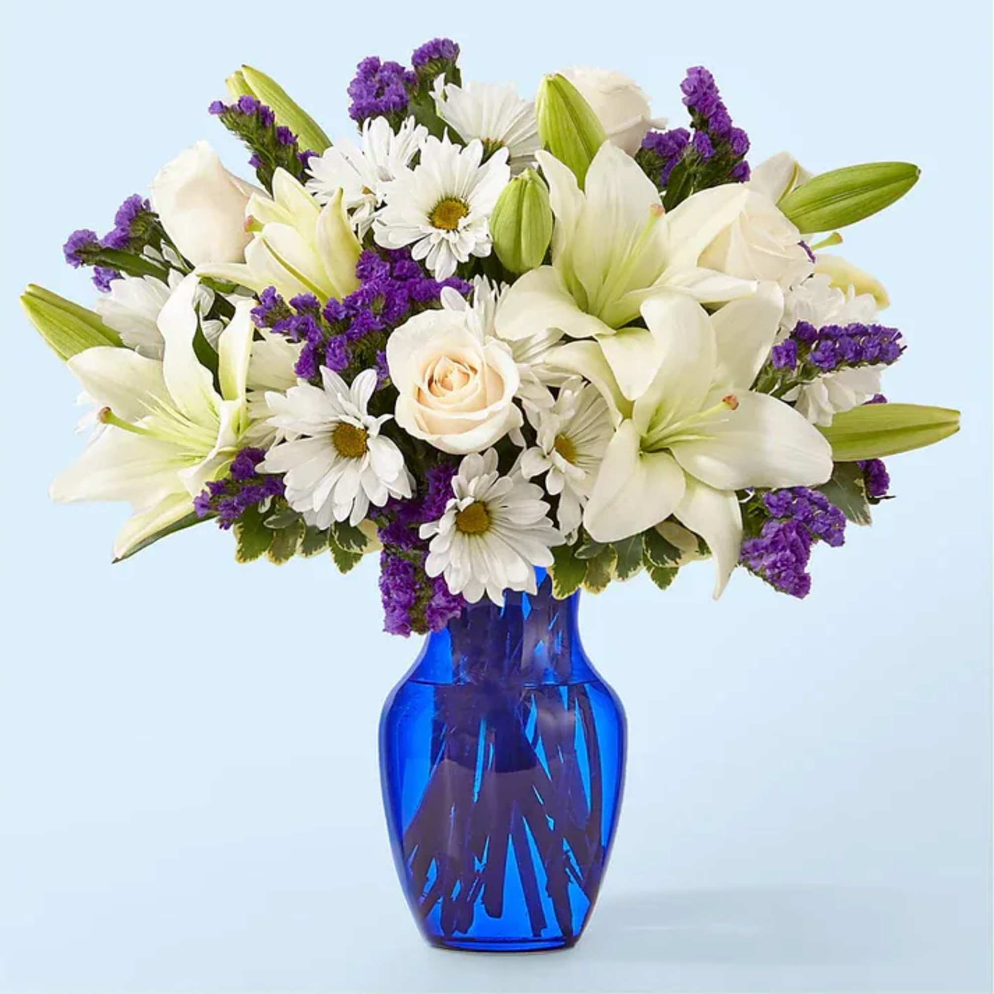 Deep purple blooms accented by creamy whites create a striking gift for