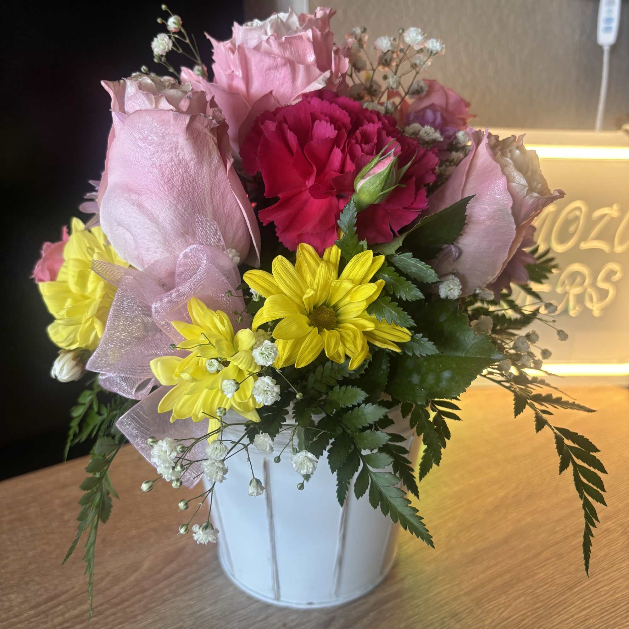 Fresh flowers in white flower pot