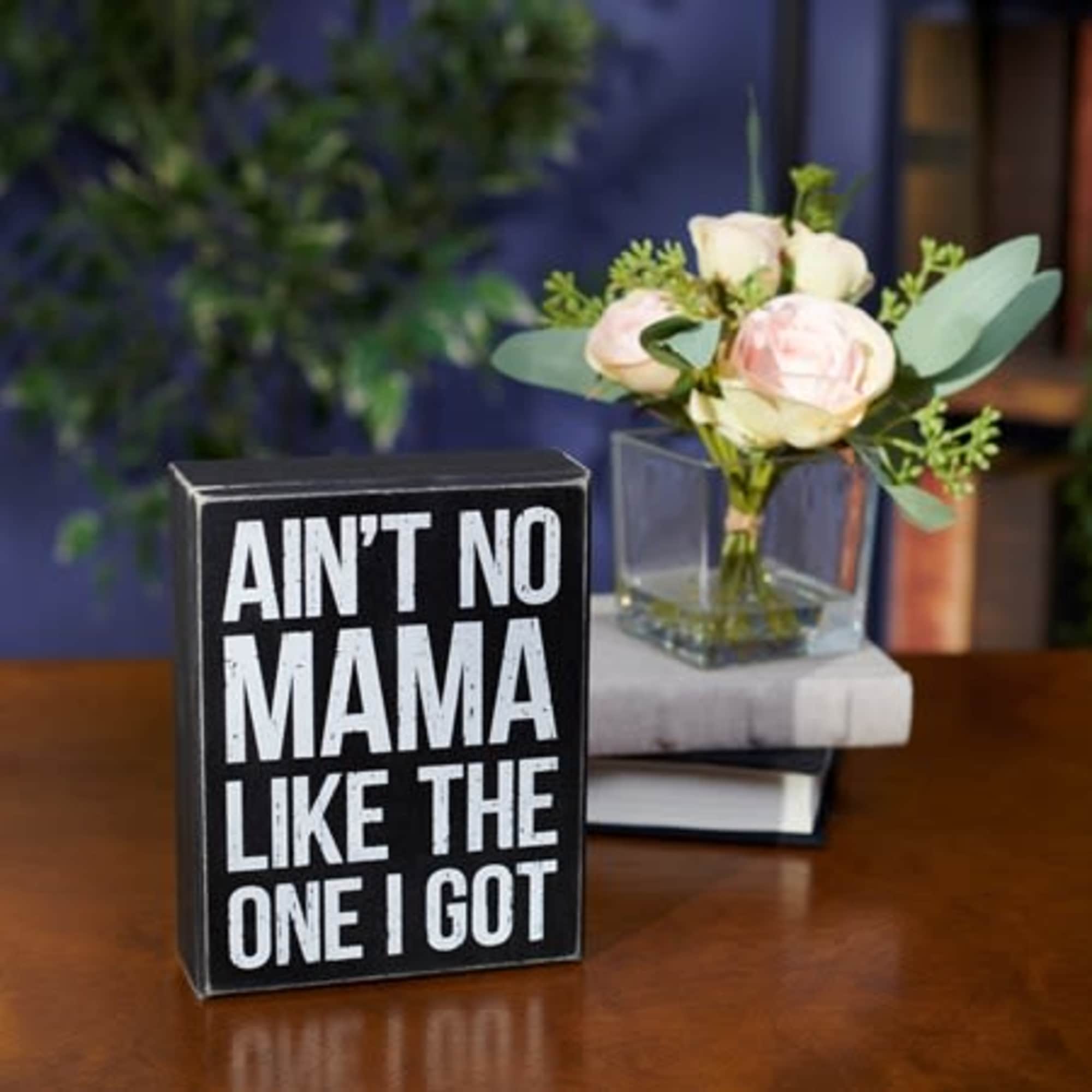 A classic black and white wooden box sign for Mother&#039;s Day displaying