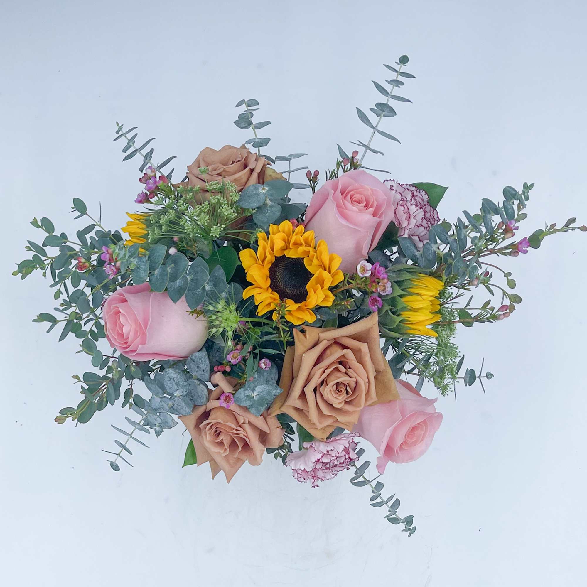 Mila is an adorable mix of Toffee Roses, Mini Sunflowers, Pink Roses