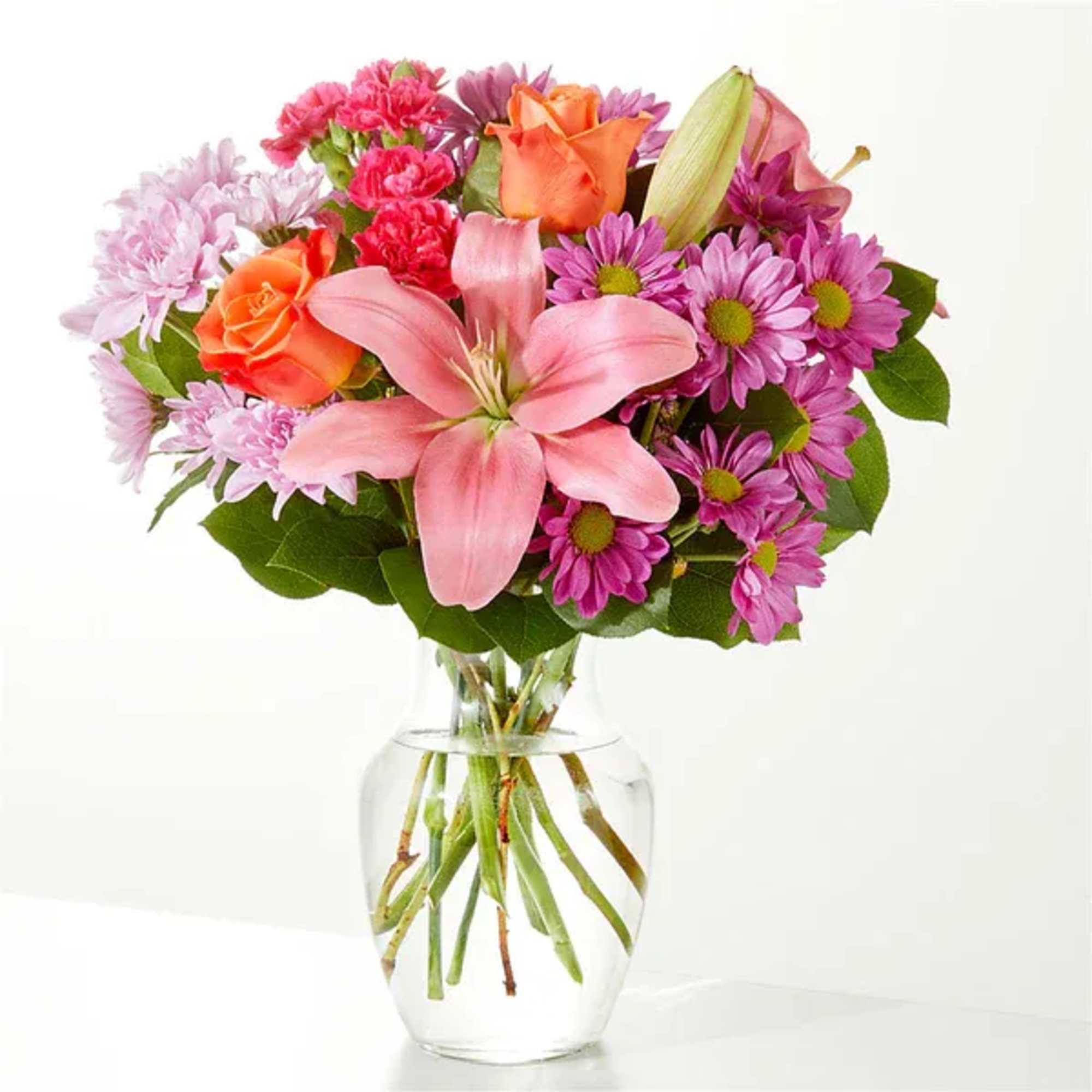 A carefully selected blend of roses, daisies, and lilies make for a