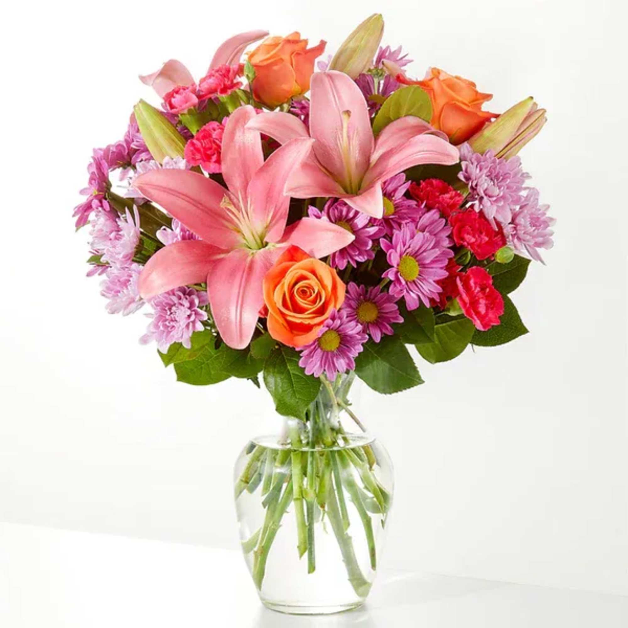 A carefully selected blend of roses, daisies, and lilies make for a