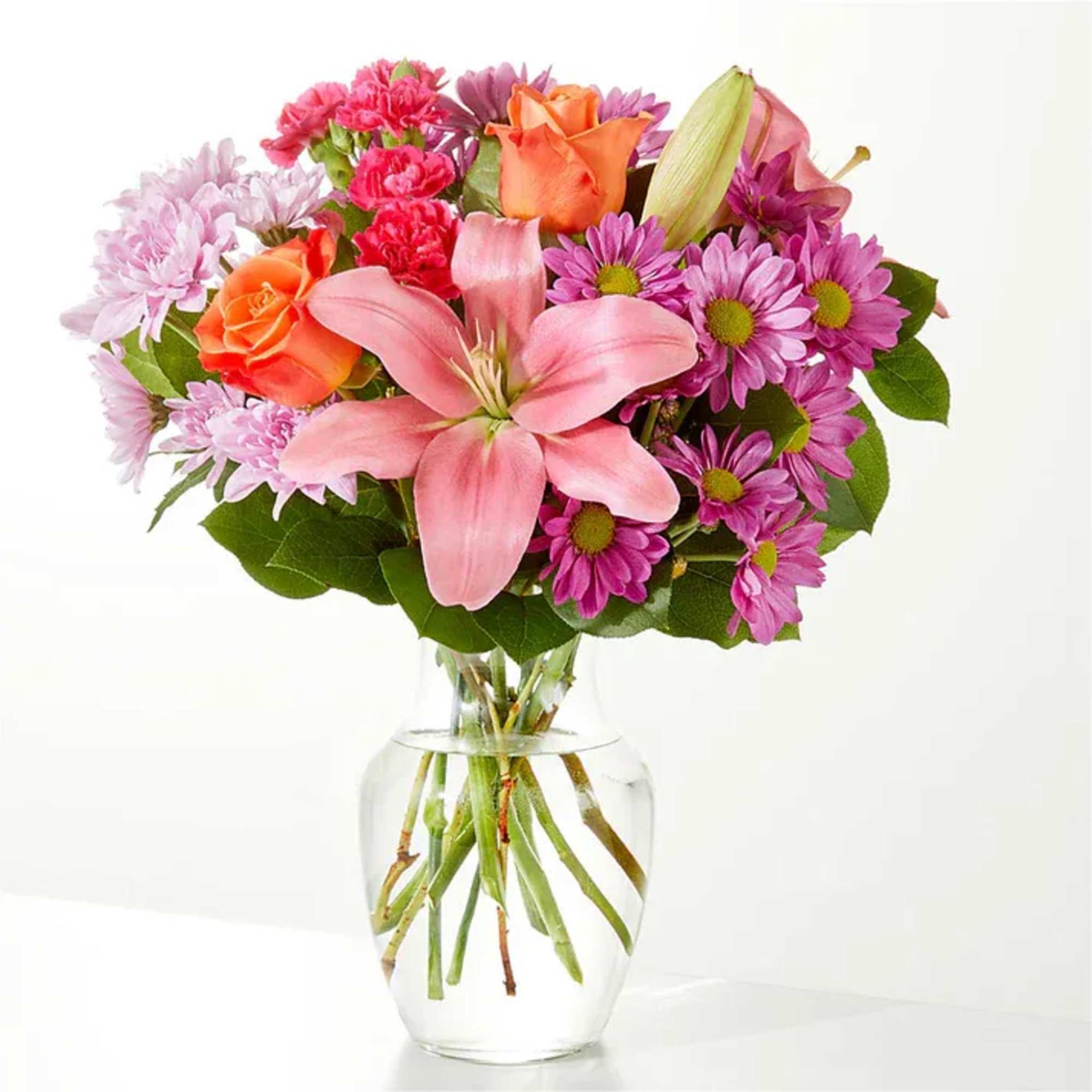 A carefully selected blend of roses, daisies, and lilies make for a