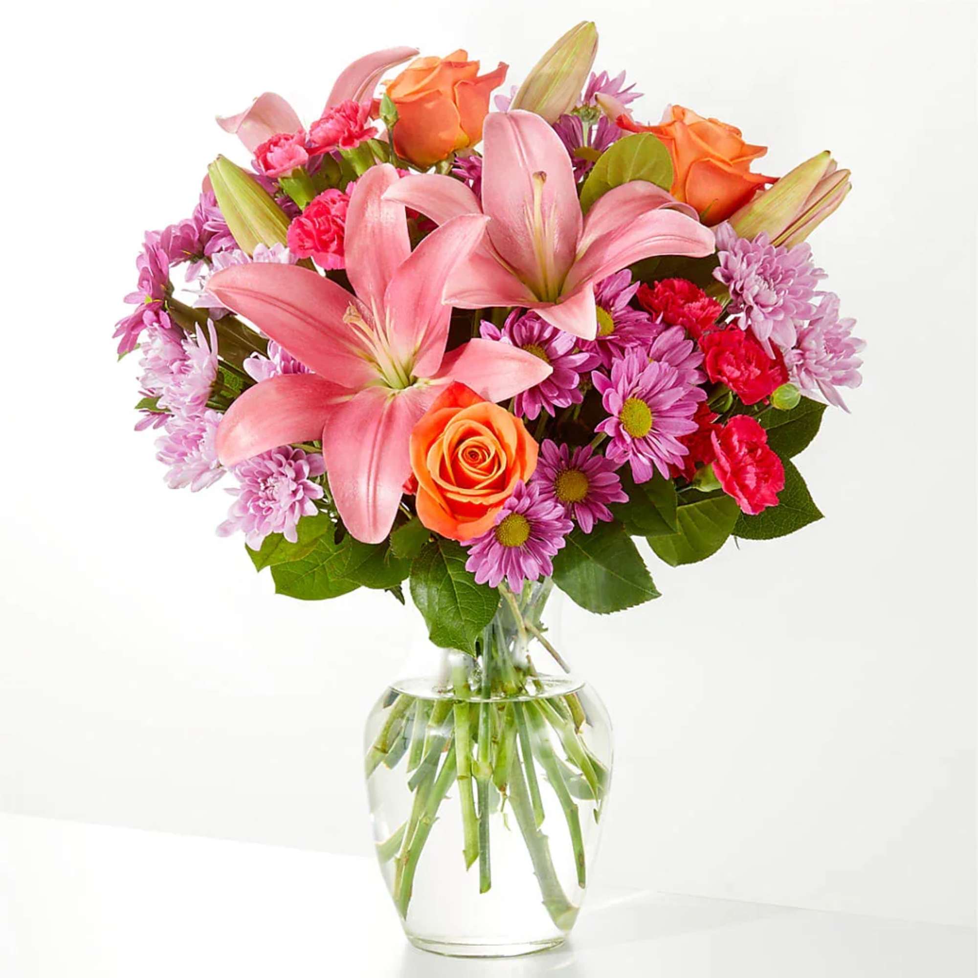 A carefully selected blend of roses, daisies, and lilies make for a