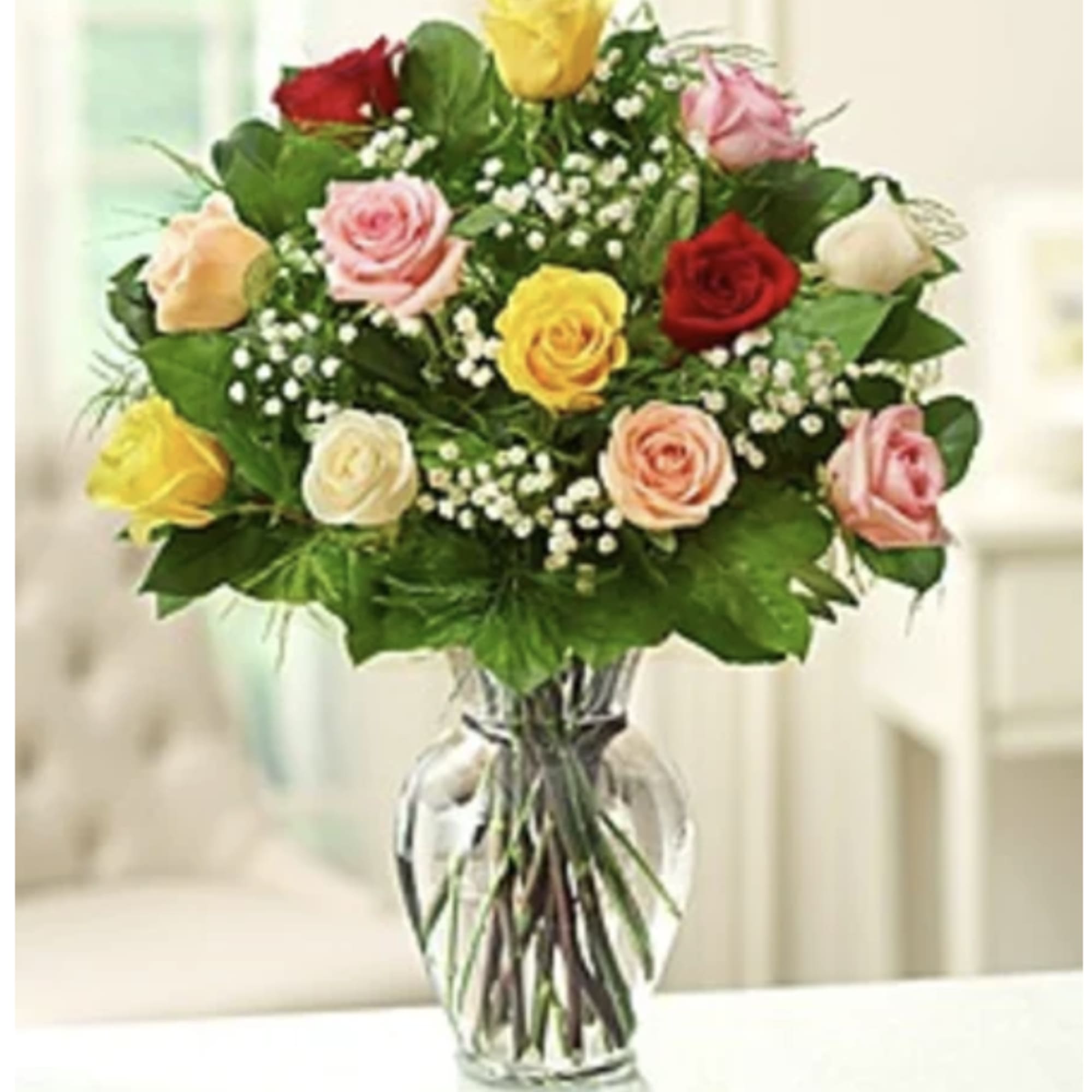 A dozen gorgeous mixed roses are the perfect romantic gift to send