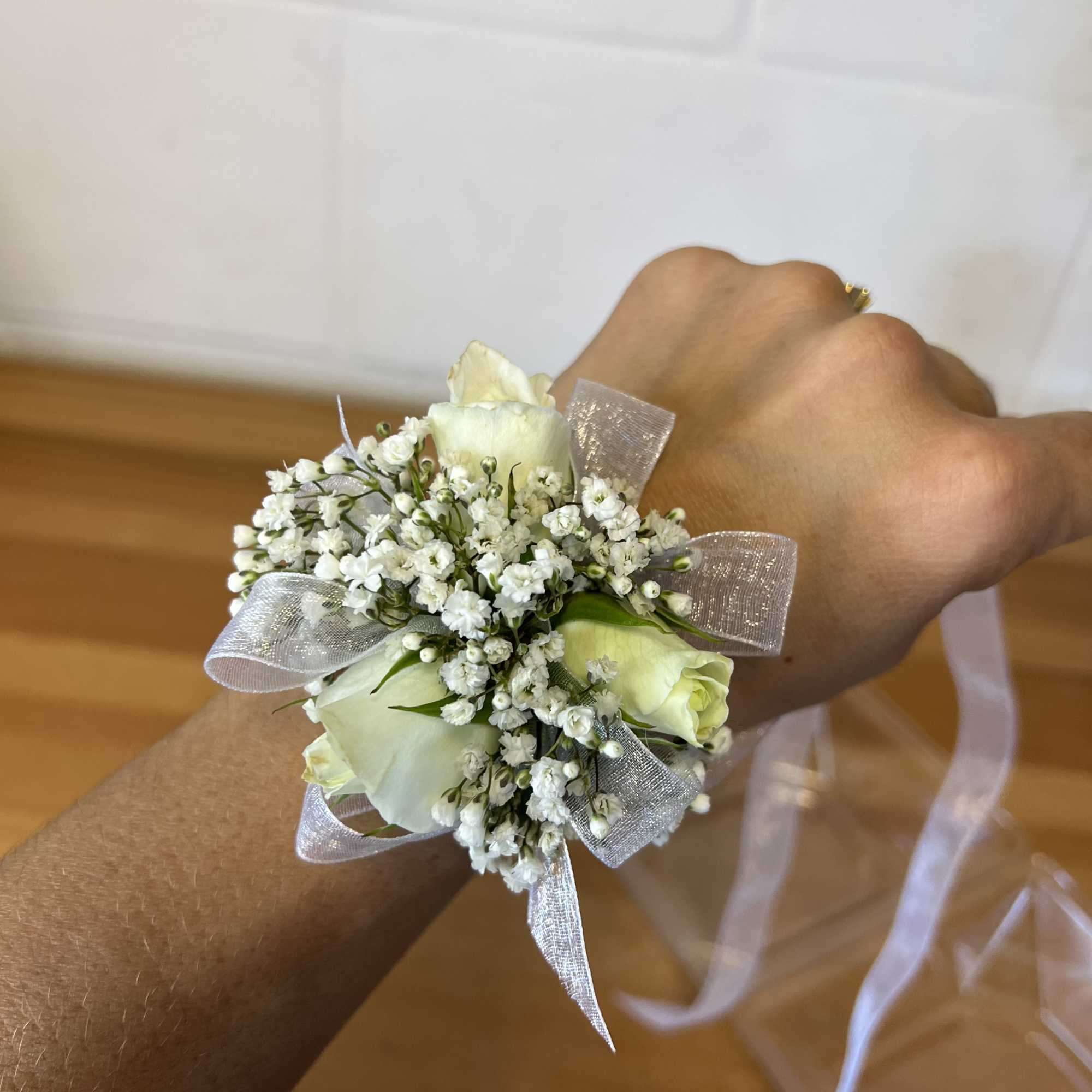 Matching corsage and boutonniere with blush tones and seasonal textures. Matching corsage and boutonniere with blush tones and seasonal textures.