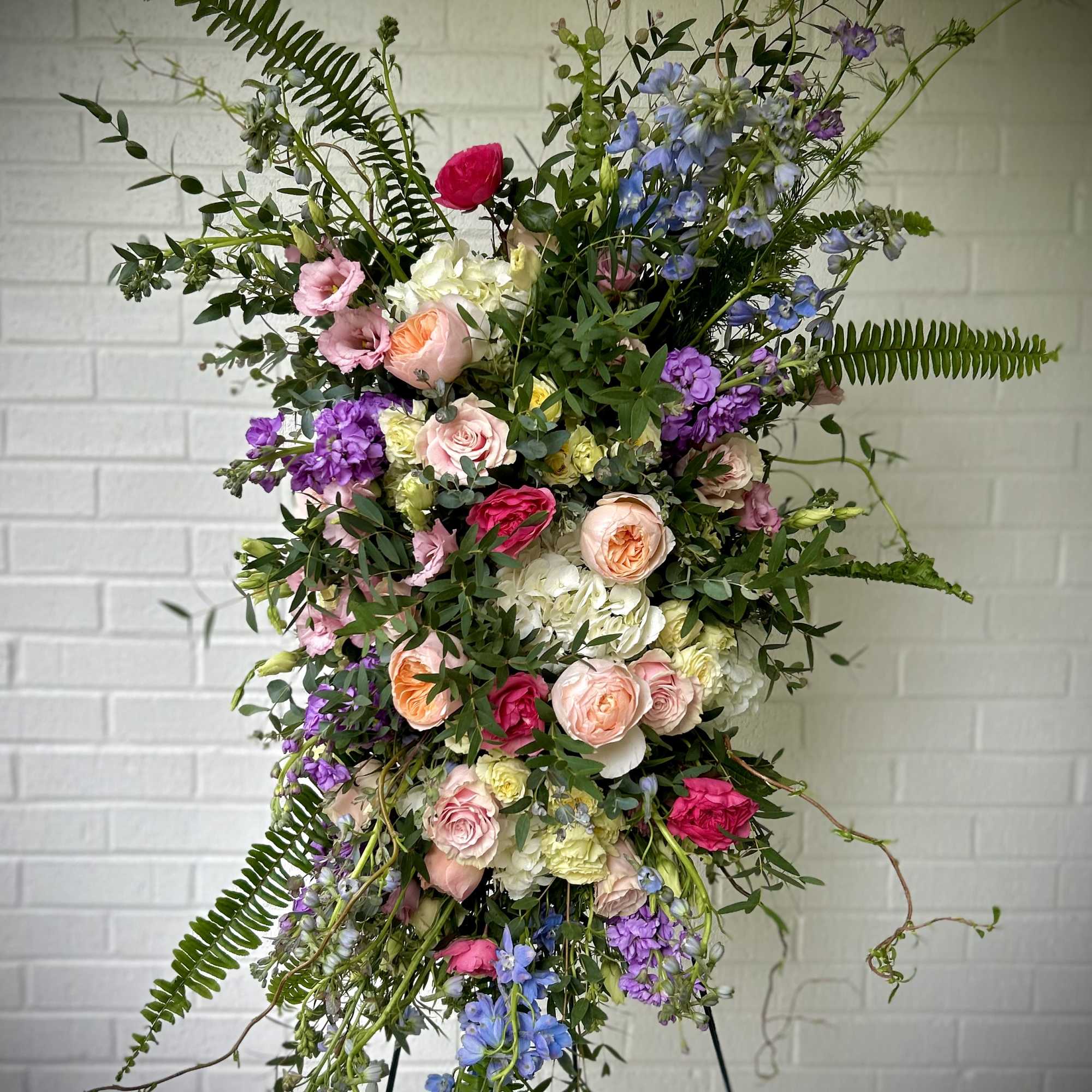 We create memorial sprays ranging from traditional neutral displays of white and
