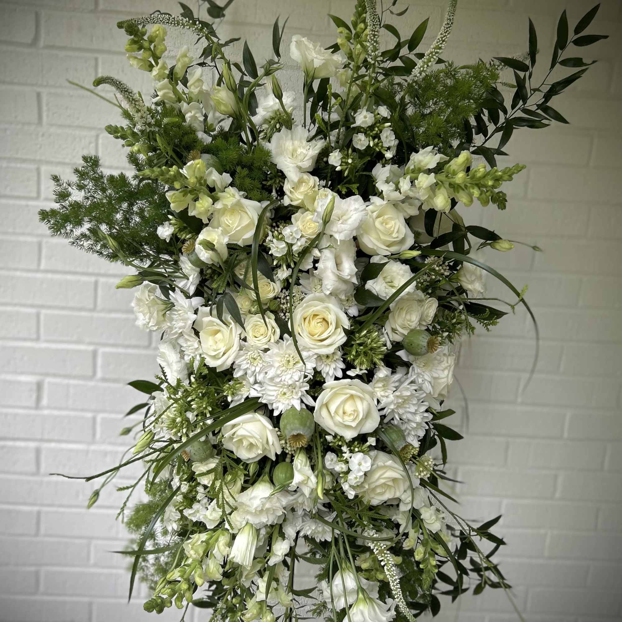 We create memorial sprays ranging from traditional neutral displays of white and