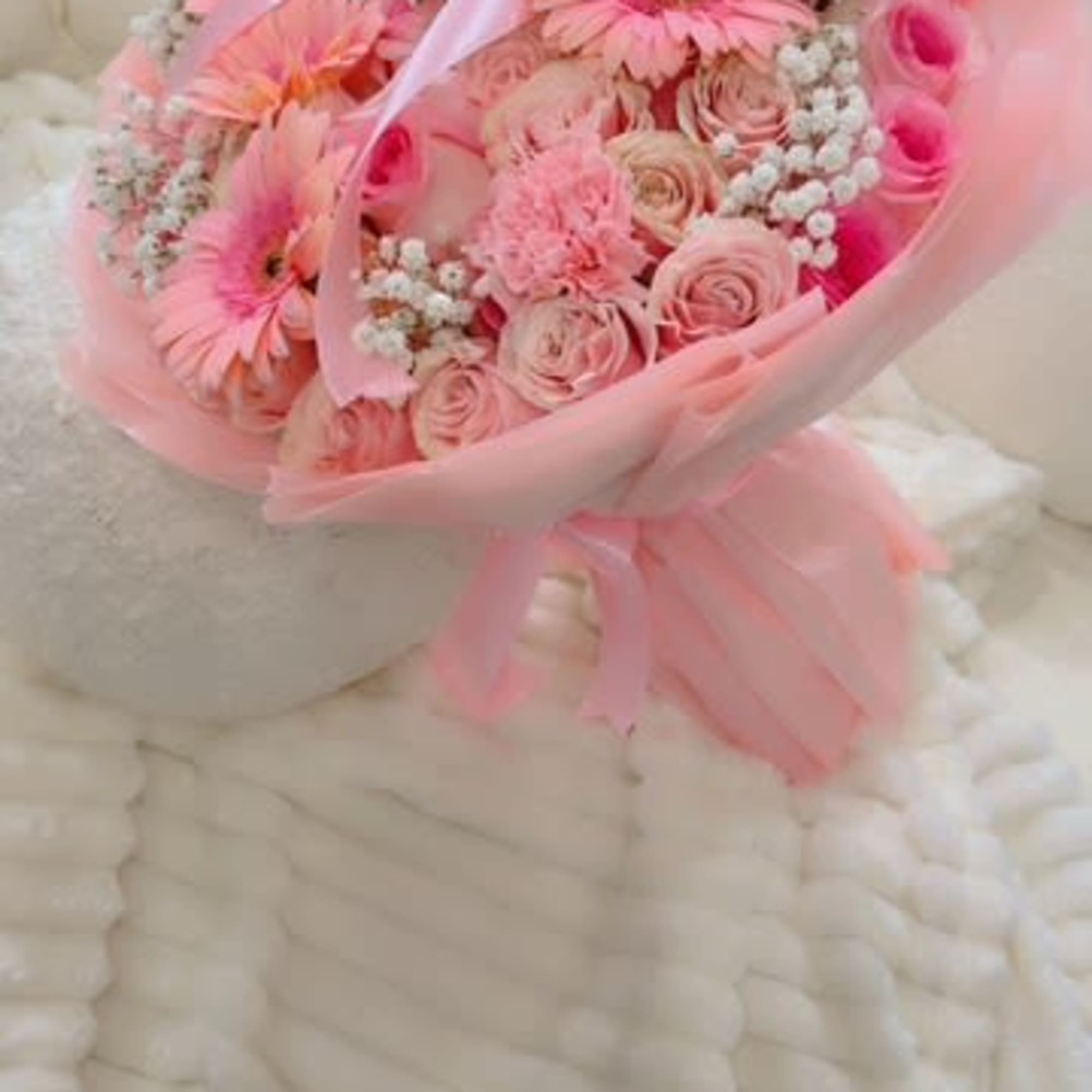 A soft and elegant bouquet bursting with blush pink gerberas, roses, carnations A soft and elegant bouquet bursting with blush pink gerberas, roses, carnations