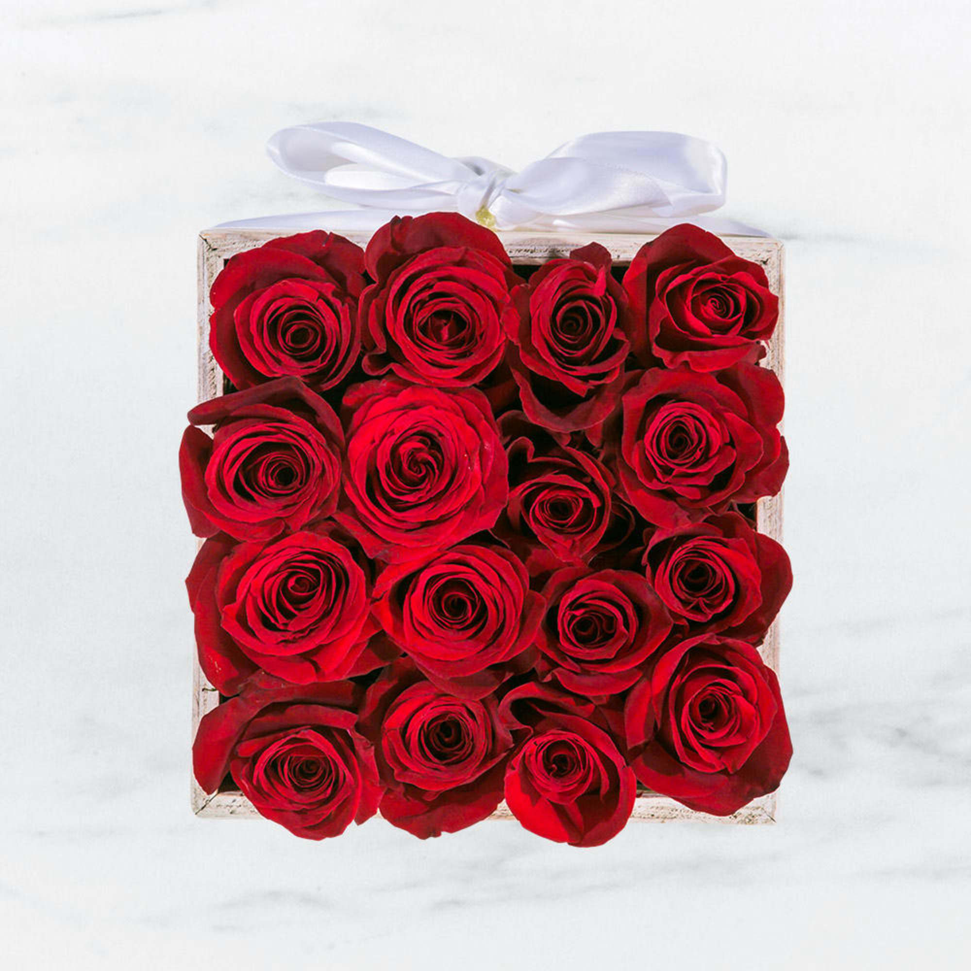 This eye-catching arrangement offers a modern twist on the classic dozen! 