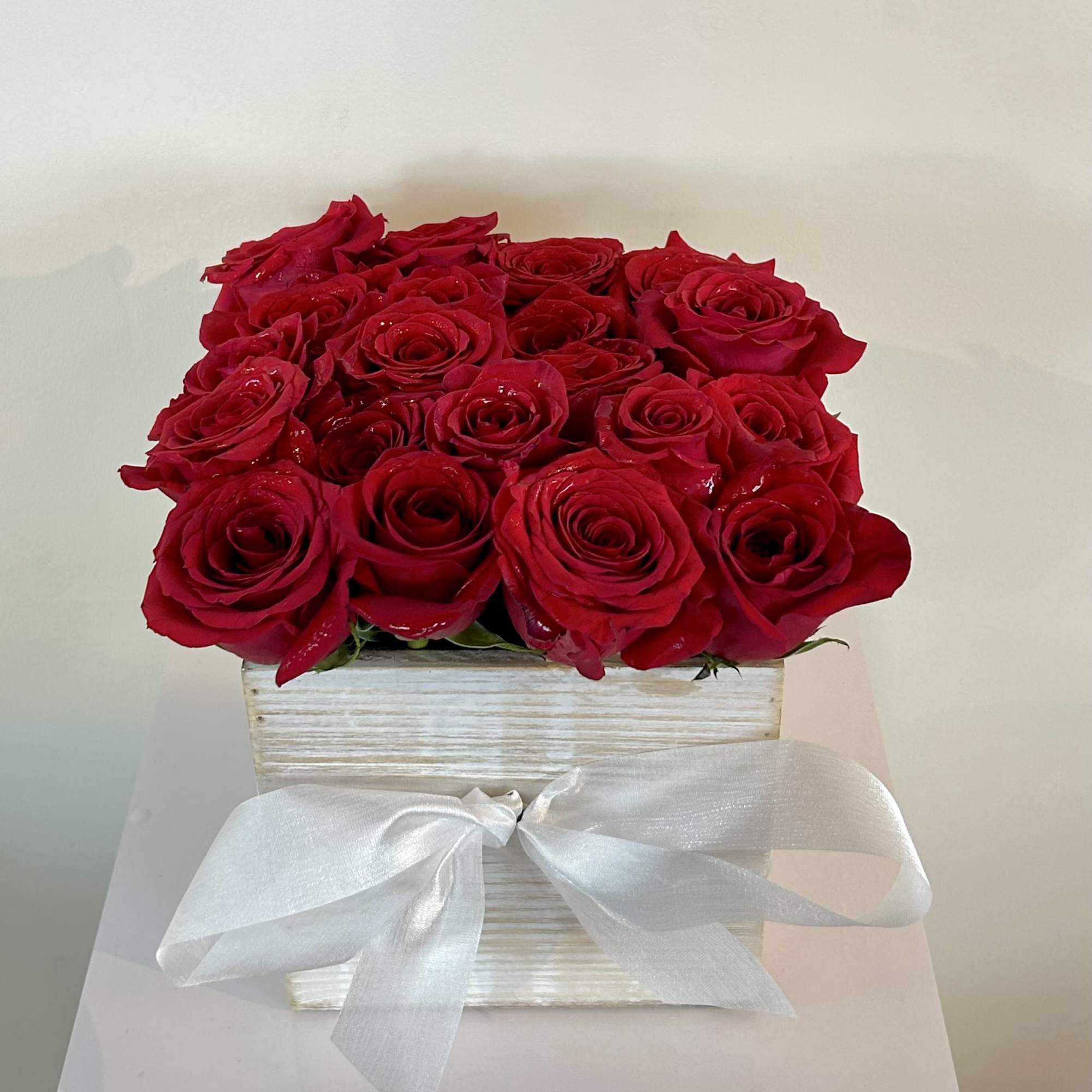 This eye-catching arrangement offers a modern twist on the classic dozen! 