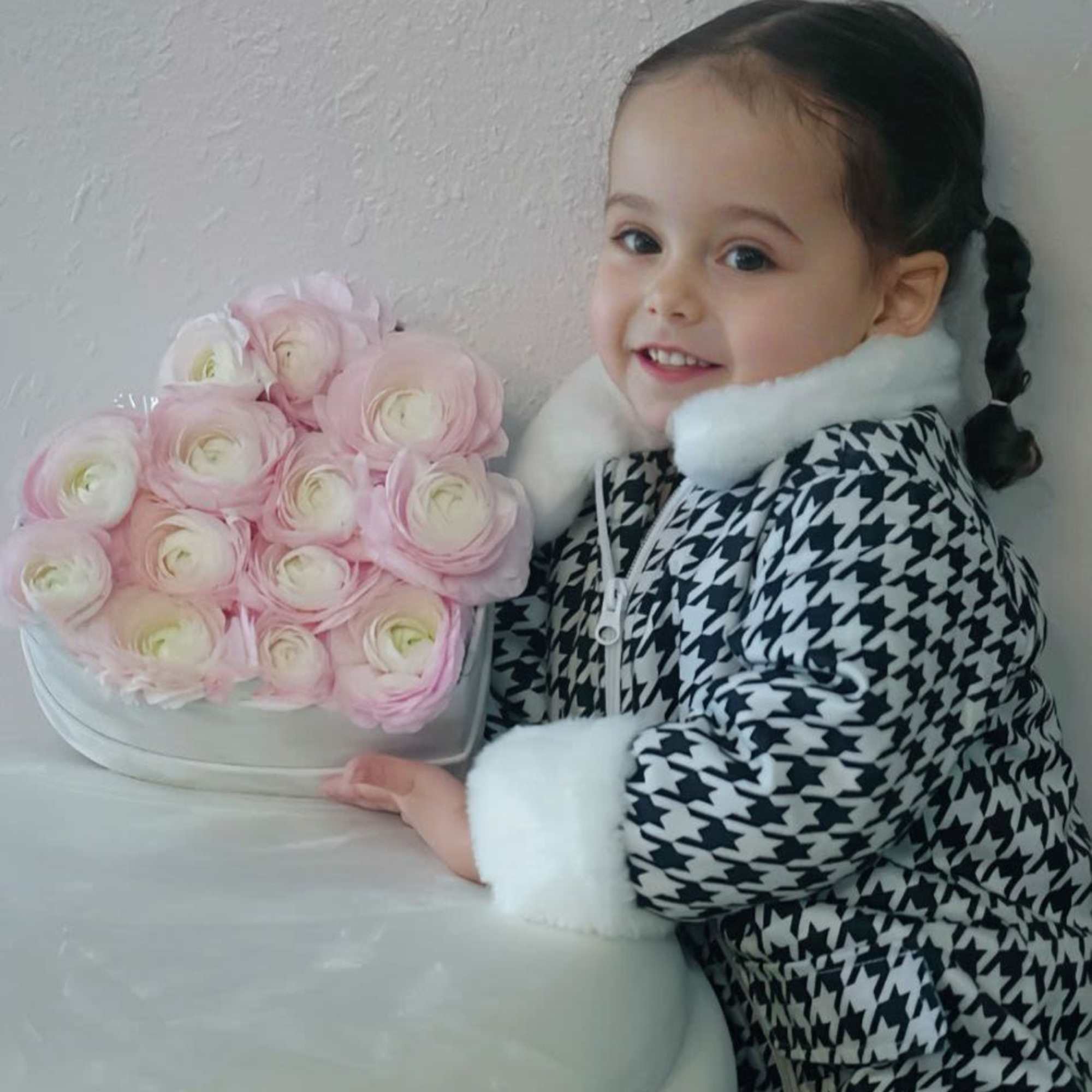 A sweet and delicate arrangement with imported ranunculus, perfect for little girls