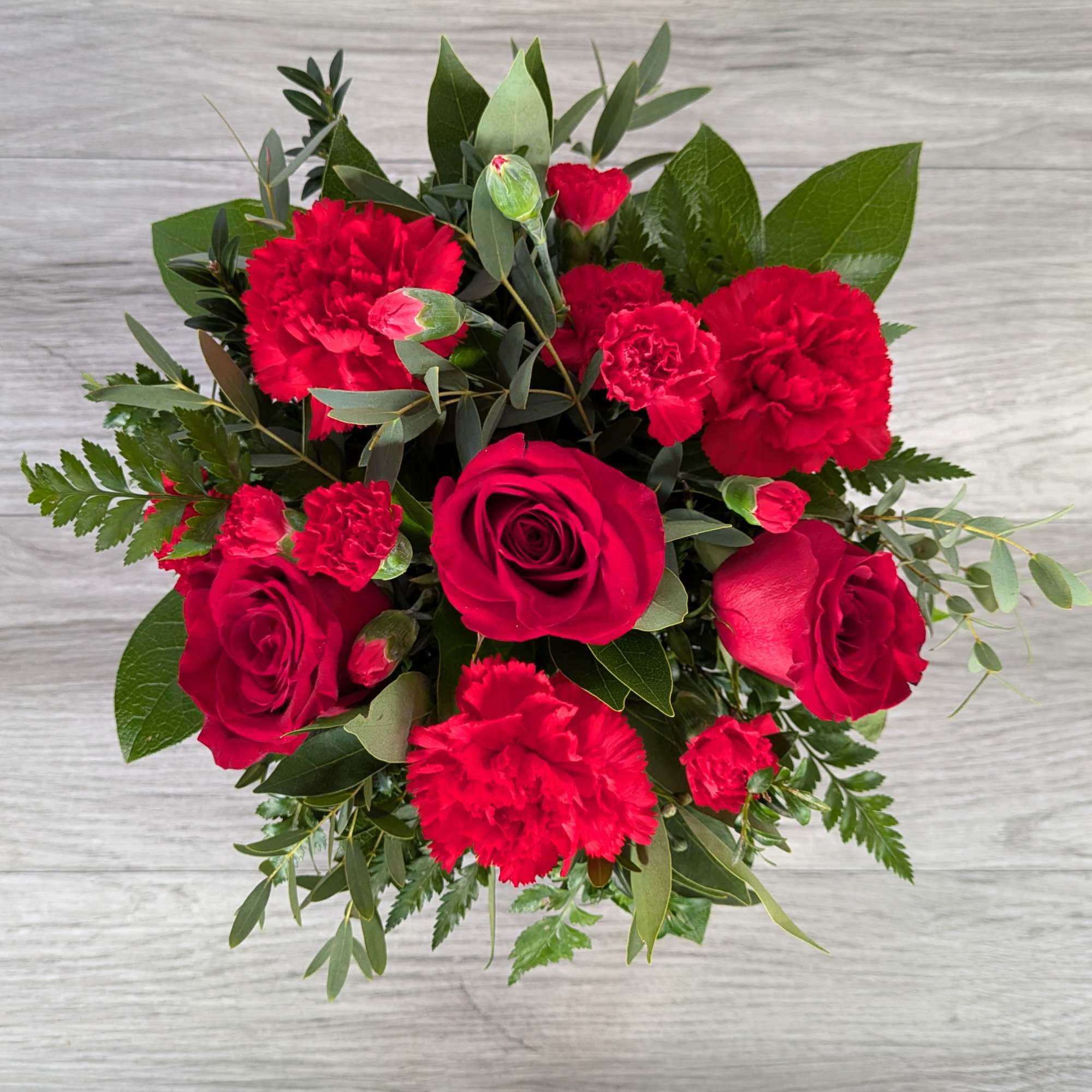 Love Letter is A Ladybug Floral exclusive bouquet, including roses, carnations, and