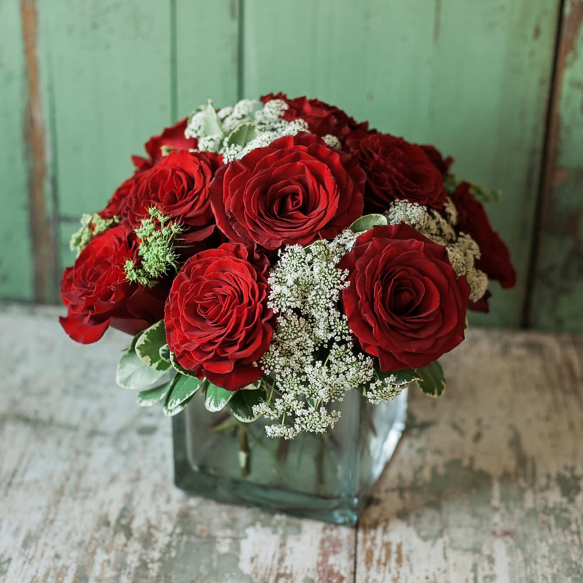 8 premium deep red garden roses arranged in a mounded style with 8 premium deep red garden roses arranged in a mounded style with
