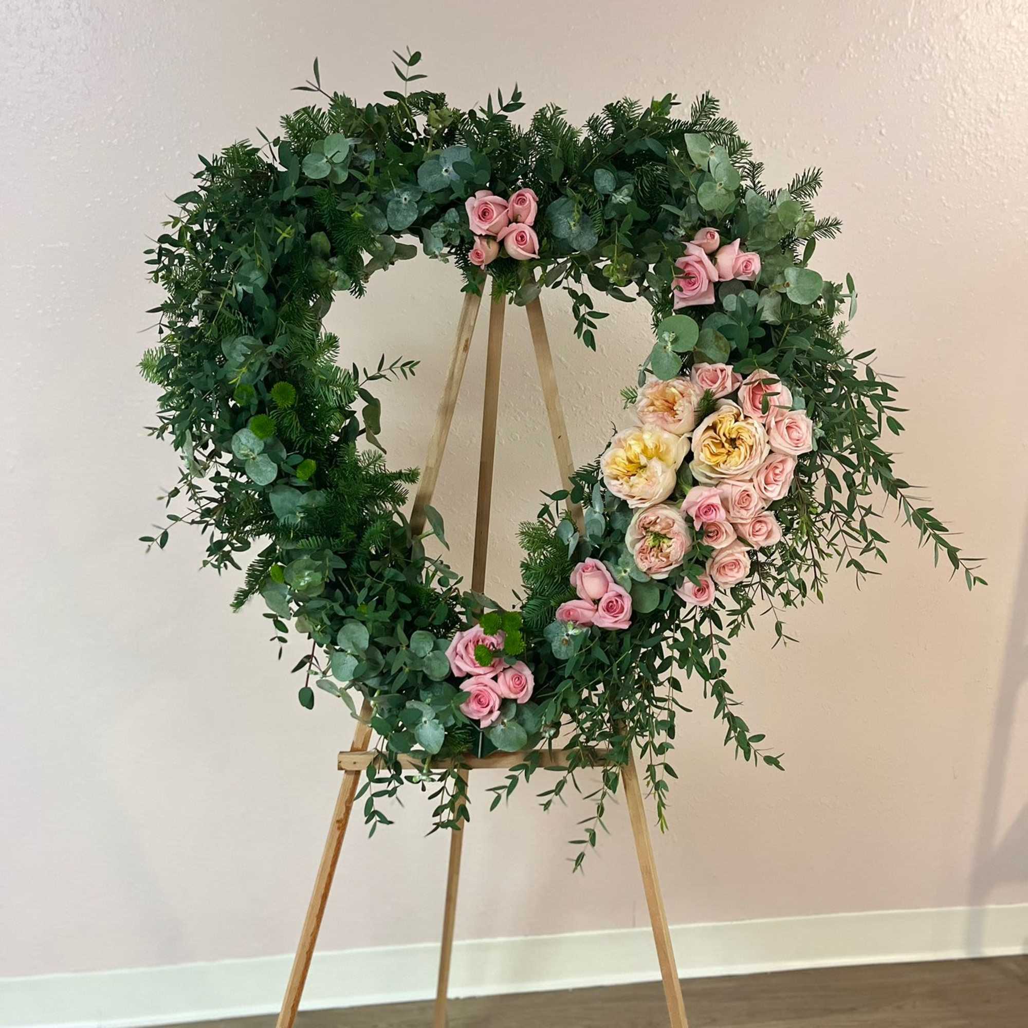 &quot;A funeral heart of Garden Roses, carefully designed to convey elegance and