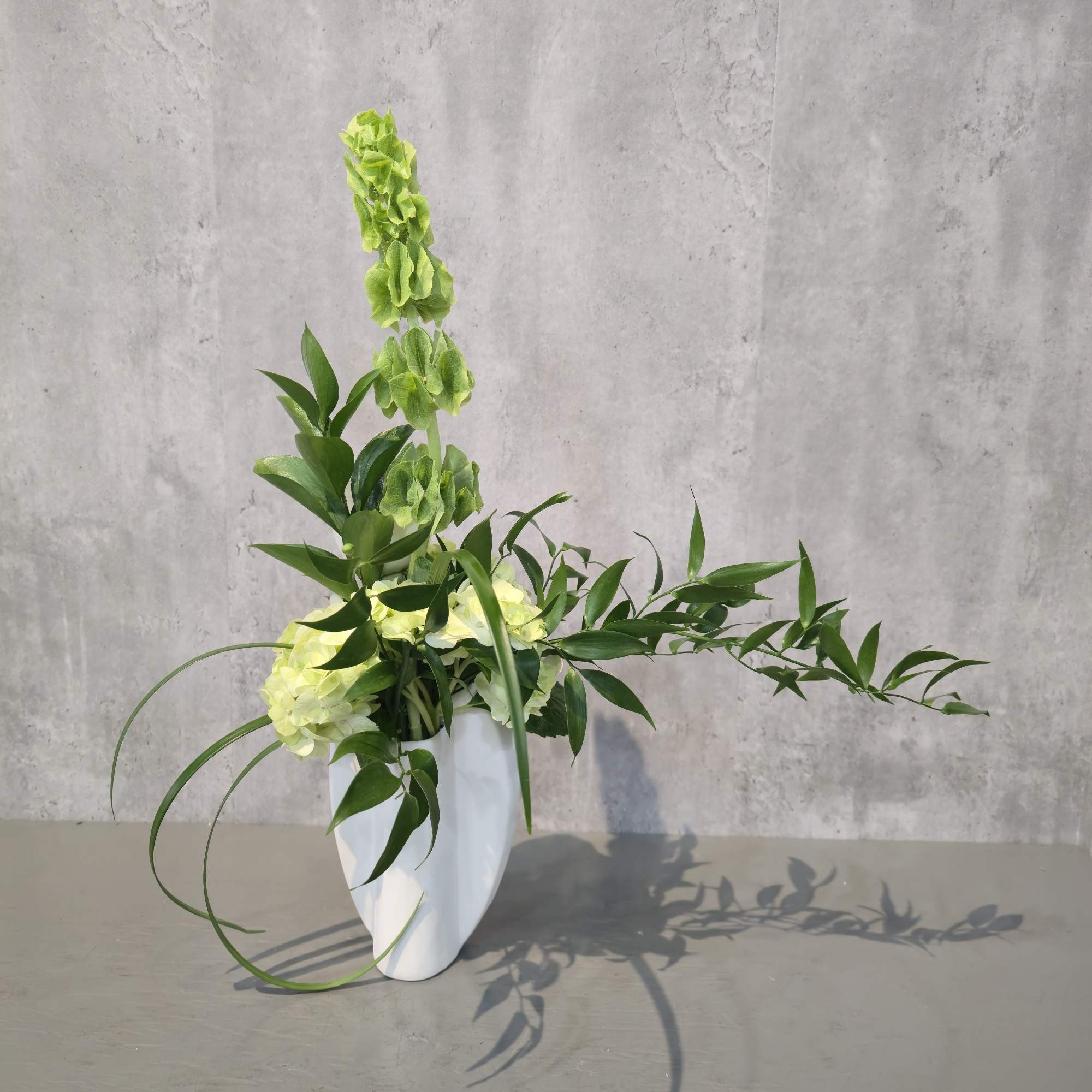 Elegant simplicity meets artistic flair in our &quot;Amelia&quot; Arrangement. This design features