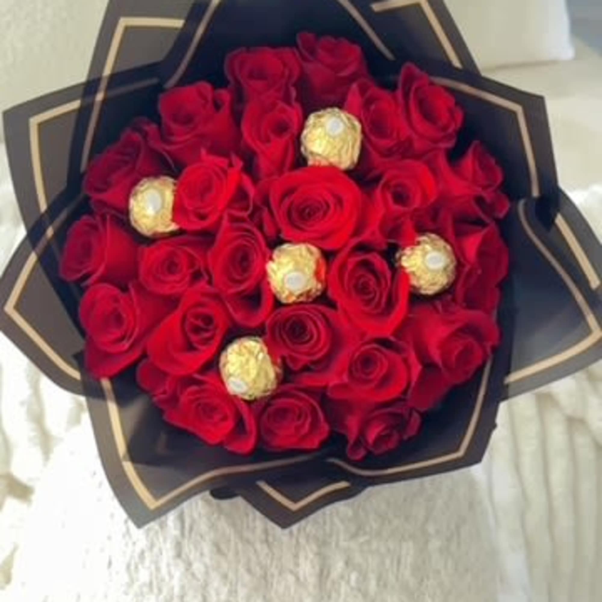 A romantic fusion of passion and indulgence. This luxurious bouquet features vibrant A romantic fusion of passion and indulgence. This luxurious bouquet features vibrant