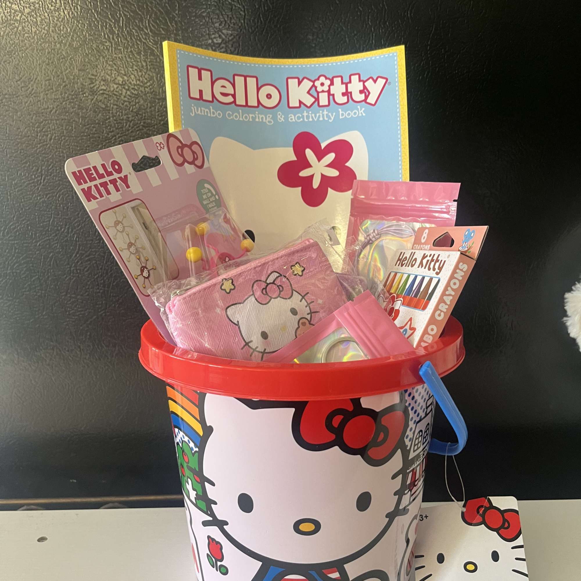 Hello Kitty basket comes with coloring book with crayons ,  coin