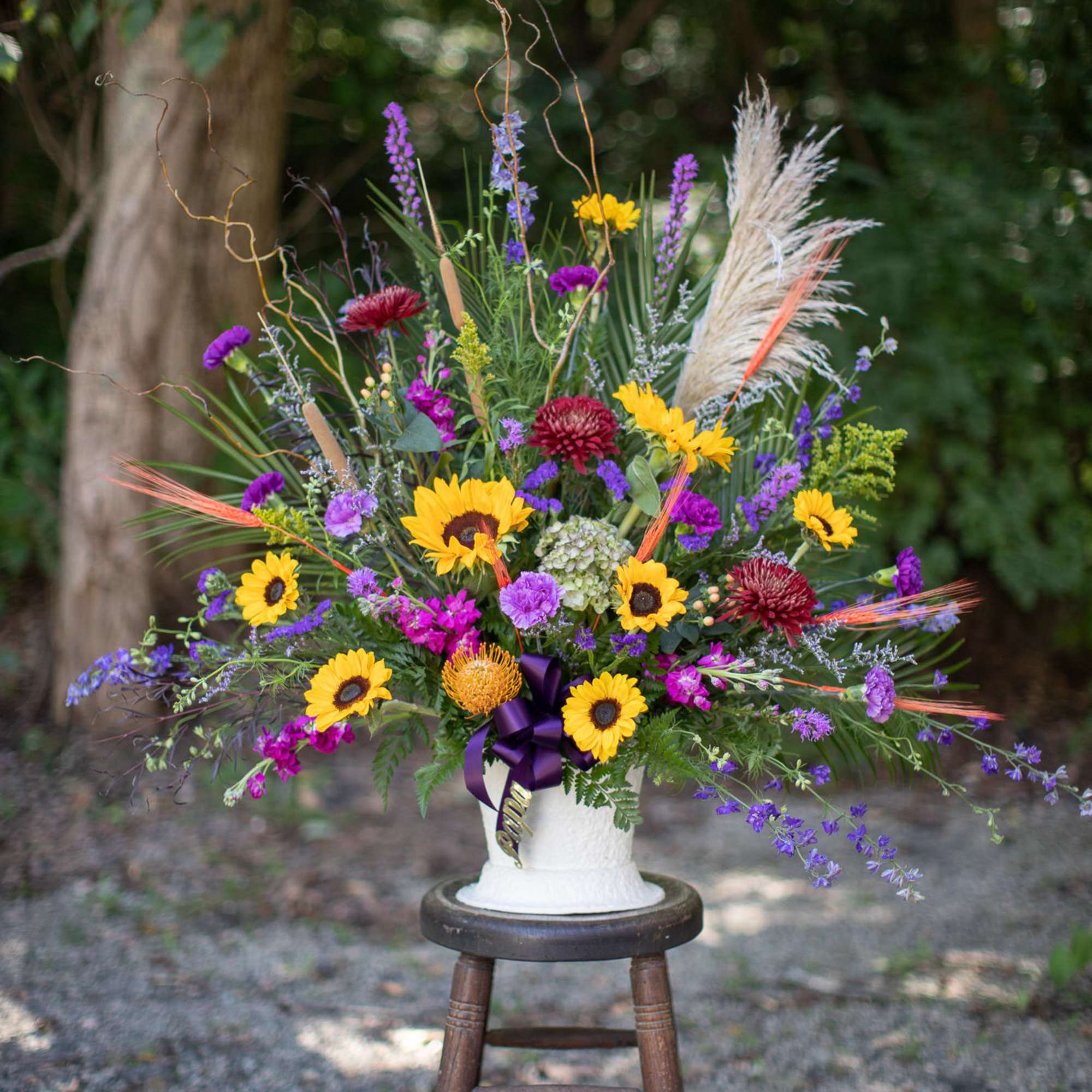 A one sided large scale basket of seasonal flowers to coordinate the A one sided large scale basket of seasonal flowers to coordinate the