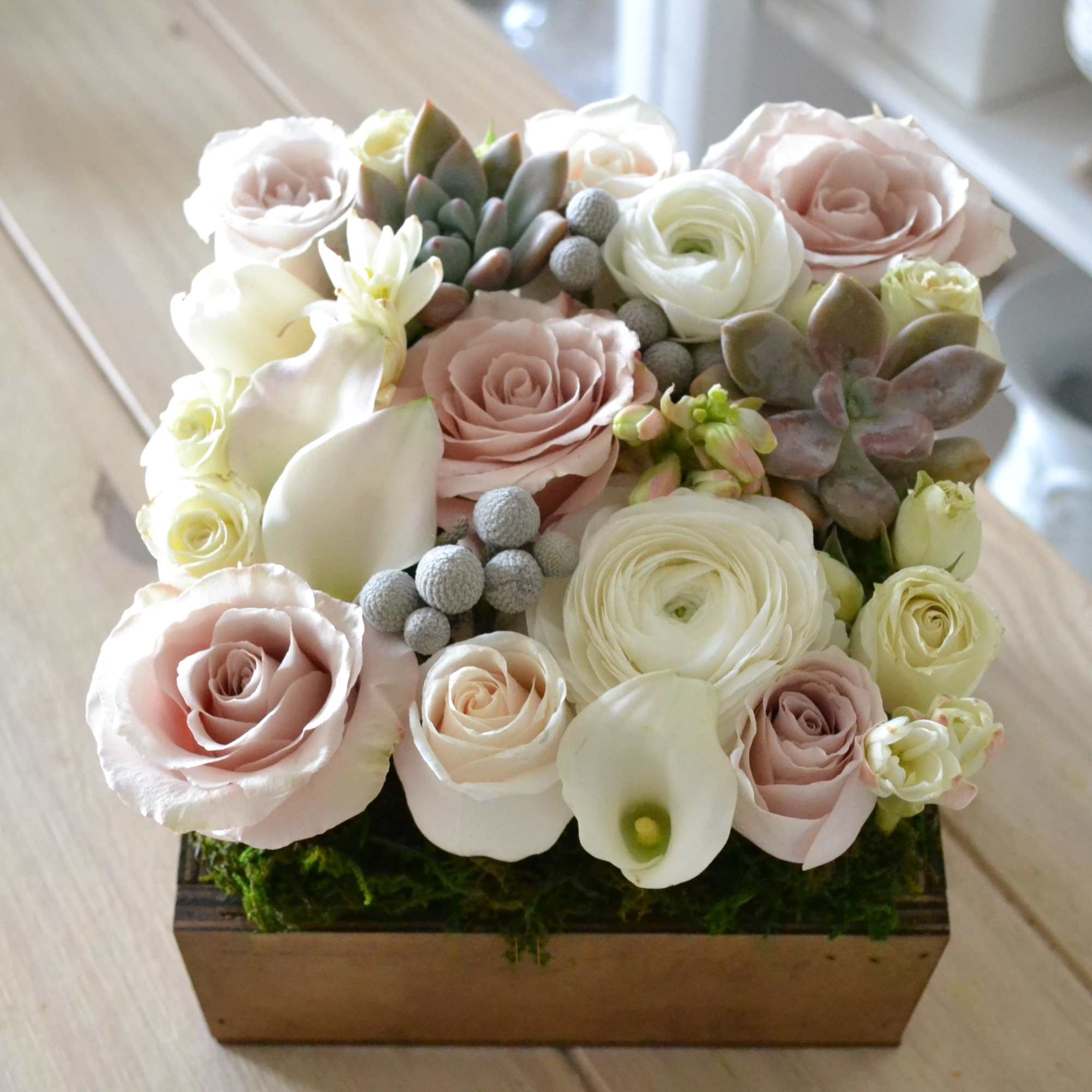 Beautifully designed arrangement in a 7"X 7" square wood box with ivory