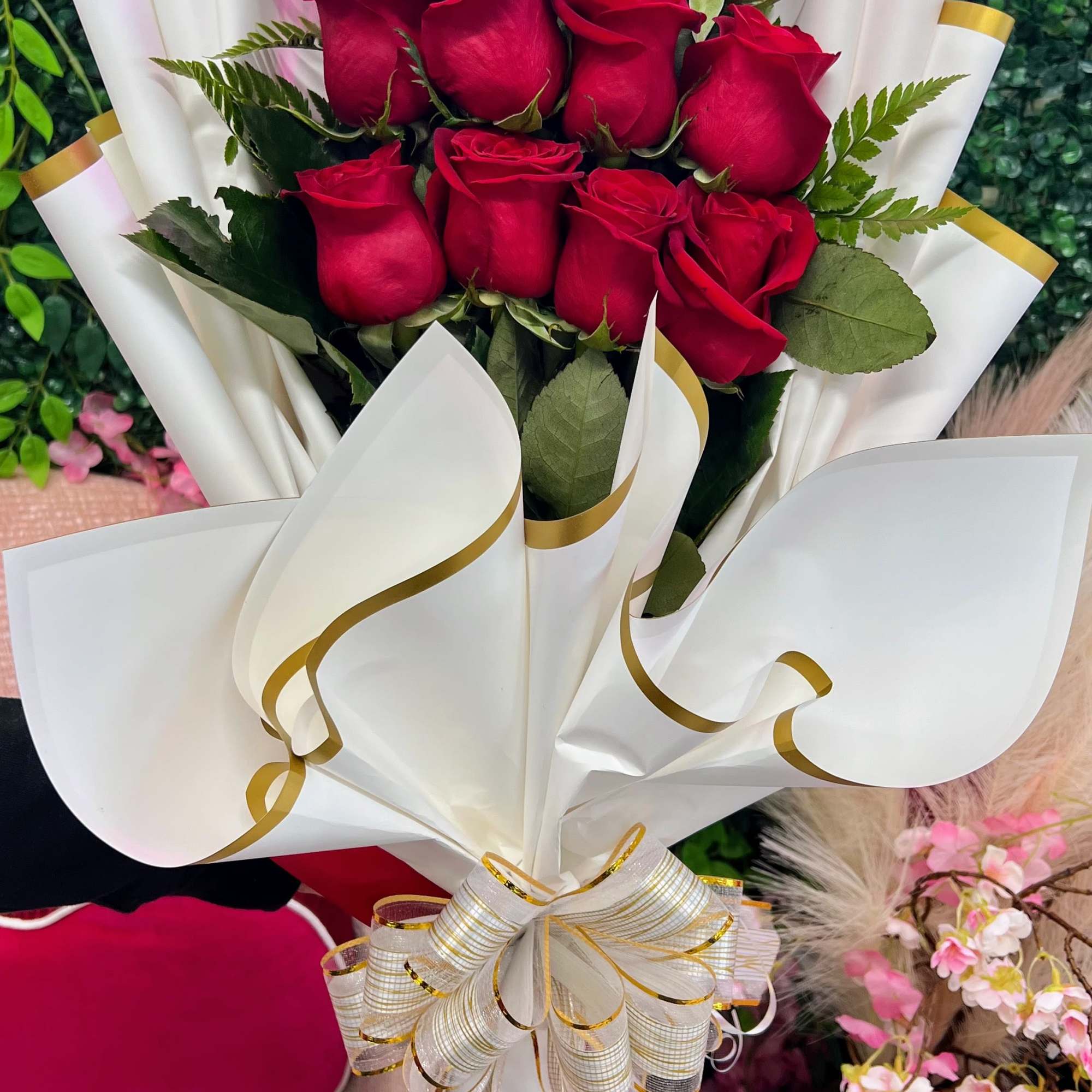 This is a stunning presentation of deep red roses, symbolizing passion and