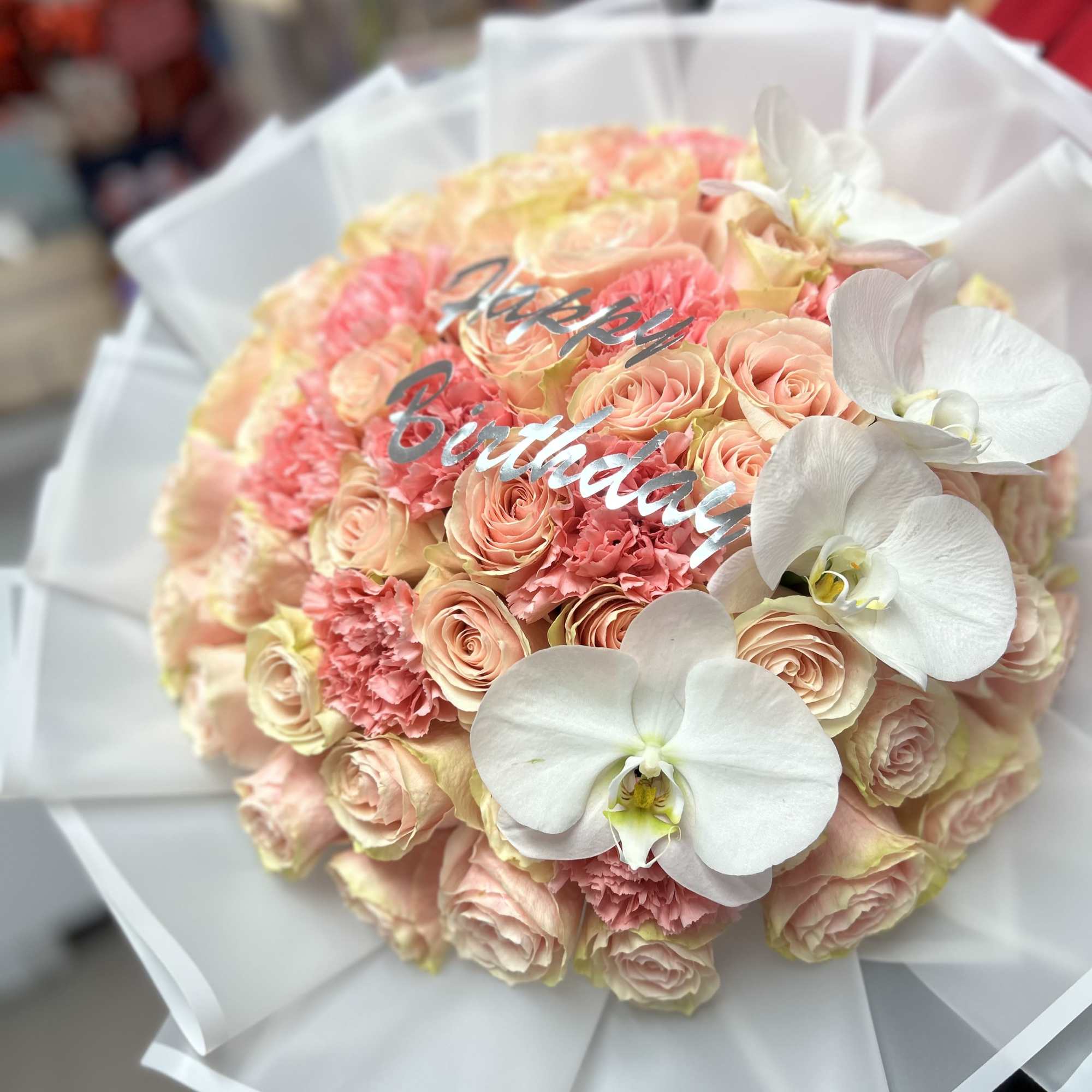 Elegant bouquet with 50 pink roses and carnations, combined with beautiful and